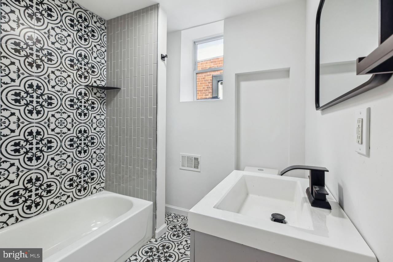 This fully renovated 3-bedroom, 1.5-bathroom row home in Point Breeze is brand new from top to bottom. The home features central heat and air, main floor in-unit washer/dryer, a chef’s kitchen with modern appliances, and a stylish, tiled bathroom. The open living and dining area has new LVP flooring, lots of natural light and the convenience of a powder room. Each bedroom is spacious offering ample room for living or office space and the basement provides additional storage. Enjoy the convenience of a vibrant neighborhood with cafes, restaurants, and shops just steps away. Easy access to public transportation and major roads makes commuting to Center City, University City, and the stadium district simple. Tenant responsible for all utilities. First/Last and one month’s security deposit due at lease signing. Credit and background checks required. Pets allowed on a case-by-case basis. *Final rent amounts for PHA applicants will be determined by PHA*
