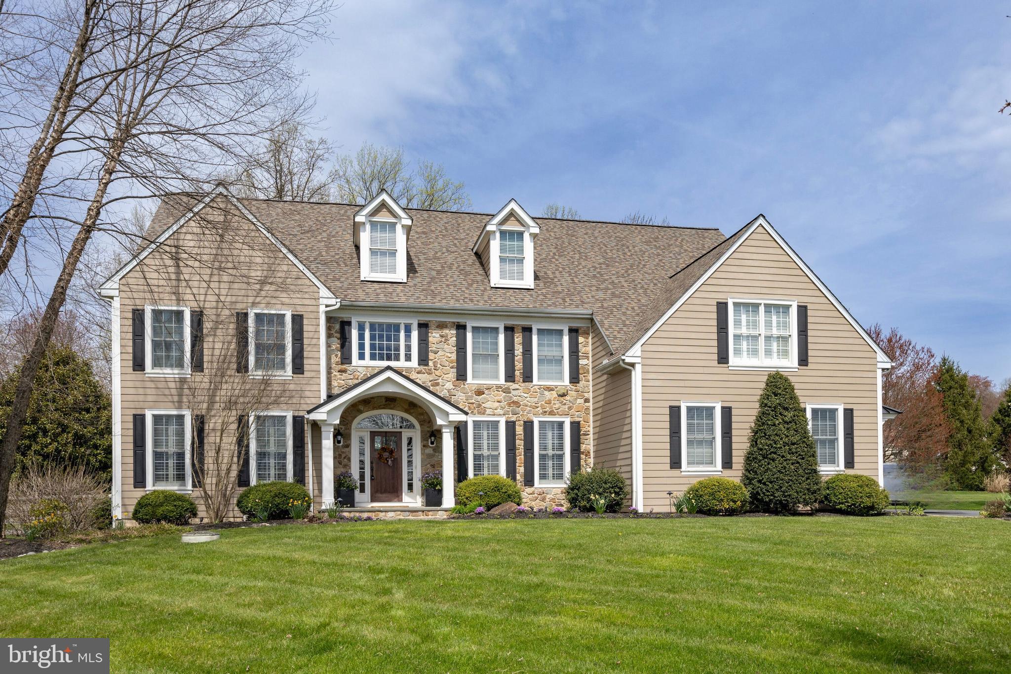 Welcome to the perfect blend of modern sophistication and timeless design at 5 Rockford Crossing Drive. With over $260,000 invested in recent renovations, this home epitomizes the essence of classic Chester County living with a contemporary twist. Nestled on nearly 2 acres in a serene cul-de-sac, enjoy unparalleled privacy and tranquility while just minutes away from Kennett Square borough, Wilmington, and West Chester borough. Step inside a grand two-story foyer that sets the tone for the elegance found throughout. To one side, a private study awaits with French doors, while the opposite side houses a formal dining room—perfect for entertaining guests. The reimagined floor plan showcases an expanded great room with a stone fireplace and a versatile bar area that can double as a playroom or library. The recently renovated kitchen boasts custom inlay cabinets, a stunning black walnut island, a porcelain slab backsplash, accented with with matching black walnut floating shelves. Top-of-the-line appliances include a Miele dishwasher, an 8-burner gas cooktop, and a 48” Sub Zero refrigerator. A breakfast area, coffee bar, and large pantry cabinet add to the functionality of this space, while the adjacent laundry room/mudroom offers seamless access to the garage and driveway. Upstairs, is an owner's suite with a sizable main room, sitting room and two walk-in closets. A newly redone modern bath with a vaulted ceiling highlighted by floor to ceiling porcelain tile, oversized mirrors and a stylish dual vanity.  A soaking tub and shower complete this spa-like retreat. Two spacious bedrooms feature a shared jack and jill bath and two more bedrooms share a full hall bathroom. Entertainment opportunities abound in the finished basement, featuring a new temperature-controlled wine cellar with cork flooring, a bar area with seating, and a full bath. French doors provide access to the fenced-in backyard, highlighted by an outdoor stone fireplace on a paver patio and a deck connecting to the breakfast room.  Rarely does a home with these unique renovations become available.