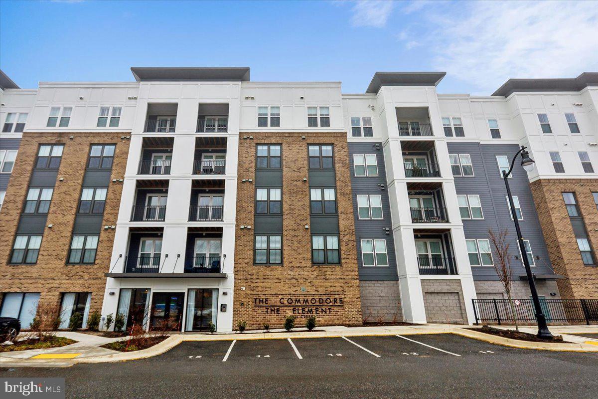 Welcome to penthouse living at Element at Mill Creek, one of Annapolis’ most stylish and thoughtfully designed 55+ communities. This 2 bed + Den, 2 bath top-floor residence with in-home laundry offers the privacy and quiet you’ll appreciate, paired with the elevated finishes and upgrades that truly make it better than new construction. From the moment you enter, you’ll notice the difference. Since purchasing, the owner has enhanced the home with carefully selected upgrades—refined lighting, custom touches, and elevated finishes that go beyond the builder’s base offerings. The result is a move-in-ready home with personality, warmth, and polish already in place. No waiting on construction timelines, no post-settlement projects—just effortless living from day one. This penthouse unit enjoys abundant natural light and peaceful views, along with the convenience of an assigned parking space in a secure garage—providing comfort and ease year-round. Life at Element at Mill Creek is designed for connection, wellness, and enjoyment. Residents enjoy a beautifully appointed clubhouse featuring indoor and outdoor dining spaces, a state-of-the-art fitness center, gathering rooms, and even a golf simulator for year-round play. Outdoors, you’ll find pickleball courts, scenic walking trails, and a dedicated dog park—perfect for staying active and social while enjoying the thoughtfully landscaped grounds. The community’s modern coastal architecture and easy layout create a fresh, welcoming neighborhood atmosphere that feels both intimate and sophisticated. Located just minutes from downtown Annapolis, you’ll have easy access to everything that makes the area so special—waterfront dining, boutique shopping, art galleries, live music, and year-round festivals. Spend afternoons strolling along City Dock, catching a sailboat race on the Chesapeake Bay, or enjoying dinner at one of the many acclaimed local restaurants. The charm, history, and vibrant lifestyle of Annapolis are right at your doorstep. And unlike many new construction purchases—where buyers are often responsible for the majority of closing costs—this resale offers a more traditional and balanced approach, with costs typically shared between buyer and seller. Title insurance discount also available. Stylish, upgraded, and ideally located, this penthouse at Element at Mill Creek offers the perfect blend of low-maintenance luxury, active living, and the best of Annapolis just moments away.