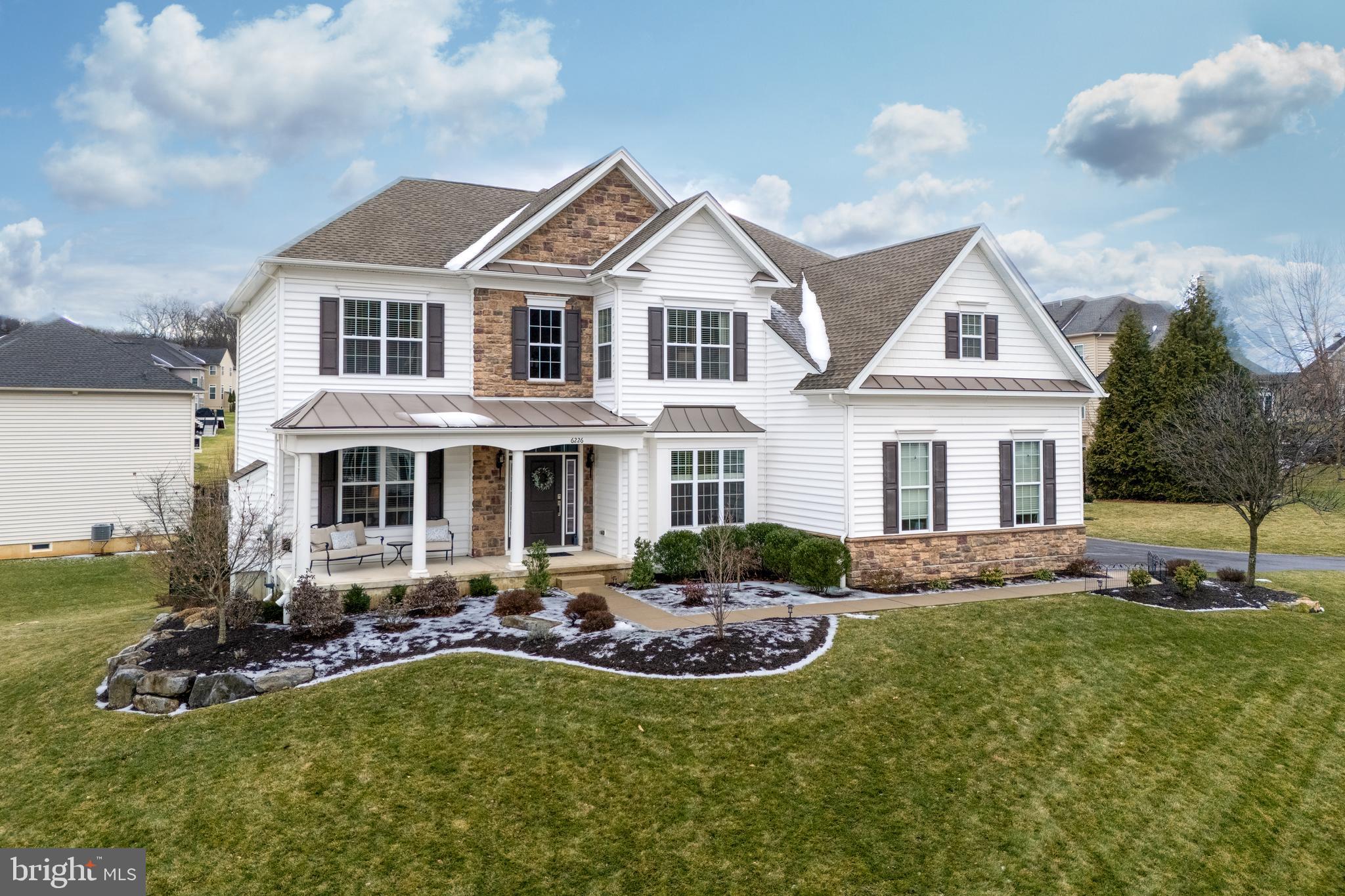 Beautifully built and impeccably maintained, this stunning WEYHILL ESTATES home offers refined living spaces designed for both everyday comfort and elevated entertaining. An expanded, covered front porch takes you inside, setting the tone as you are greeted by a DRAMATIC 2-STORY FOYER and curving staircase. Rich hardwood floors lead to TWO PRIVATE STUDIES, one with a gas fireplace and mantle. The main living areas are filled with natural light, upscale finishes, and open sight lines. The true centerpiece is the CHEF’S KITCHEN, with top-tier appliances, GRANITE COUNTERTOPS, and a magnificent center island with seating–ideal for quick meals and gatherings. The dining room and great room, with a cozy gas-burning stone fireplace, are designed for both function and flow. An additional back staircase conveniently takes you to the second level, where the stunning PRIMARY SUITE is a true retreat, featuring a spa-inspired bath, and an oversized walk-in closet. Three additional bedrooms, two with a shared ensuite and one with a private ensuite, provide flexible living options. The fenced-in yard and partially covered deck is ideal for entertaining or quiet relaxation, and a finished WALK-OUT LOWER LEVEL provides a second family room, recreation room, workroom and storage space. Designed for the discerning buyer, this home blends modern luxury and exceptional livability—an elevated offering in today’s market. Peace of mind included, pre-Settlement home inspection is available.