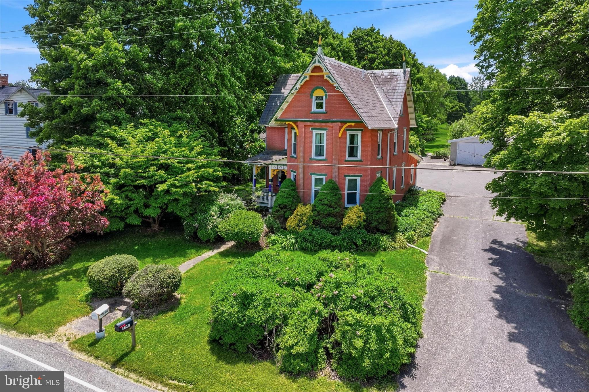 Welcome to this charming Victorian home nestled on the desirable northwest side of Quakertown. Ideally located with convenient access to the Pennsylvania Turnpike and just minutes from the popular Spinnerstown Hotel, this beautifully maintained four-bedroom home blends historic character with modern updates.  Built in 1890, the home has been thoughtfully improved over the years while preserving its timeless appeal. The spacious first floor features a large eat-in kitchen, a generously sized dining room, a cozy living room at the front of the home, and a comfortable den/family room perfect for relaxing or entertaining.  The second floor offers two bedrooms, a full bathroom, and a dedicated office space. A staircase accessed through the office leads to the third floor, where you'll find two additional bedrooms along with a large storage area.  Set on 1.34 private acres, the outdoor space provides a peaceful retreat surrounded by mature landscaping. Whether you're looking to garden, entertain, or simply enjoy the tranquility, there's plenty of room to make it your own.  Car enthusiasts, hobbyists, and anyone needing extra storage will appreciate the oversized 4+ car garage, which easily accommodates vehicles, recreational equipment, and lawn tools. Plenty or space for a workshop as well! Combined with the expansive driveway, parking will never be a concern.  Additional highlights include a whole-home ultraviolet well water filtration system and public sewer service.  Showings begin at the Open House on Thursday, June 4, from 5:00 PM to 8:00 PM, with a second Open House scheduled for Saturday, June 6, from 12:00 PM to 3:00 PM.