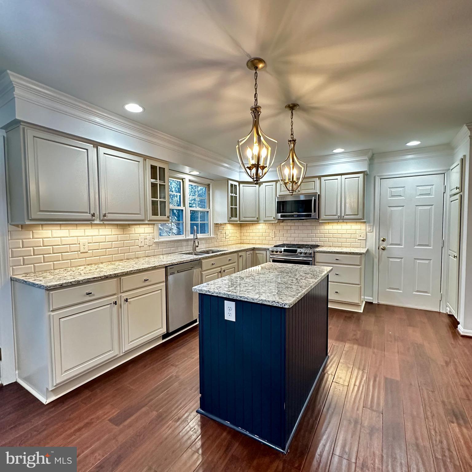 Stunning Single-Family Home! Entire home freshly painted! The main level boasts an elegant formal dining room with wood flooring, chair rail molding, and a captivating chandelier. Enjoy a separate living room adorned with recessed lighting. The gourmet kitchen is a culinary haven, equipped with stainless-steel appliances, granite countertops, including an island, and ample cabinet space. A dedicated dining area adds to the charm. The kitchen leads to a spacious back deck with a retractable awning and a fully fenced backyard. The family room is a cozy retreat with a fireplace and mantel. Upper level with all new updated flooring! The primary bedroom features vaulted ceiling, recessed lighting, and two closets. The newly renovated primary bathroom boasts a dual vanity, stall shower, and a tub. Three additional bedrooms share a well-appointed hallway bathroom. The property also features an unfinished basement- great for storage, laundry, and a convenient 2-car garage. Apply now!
