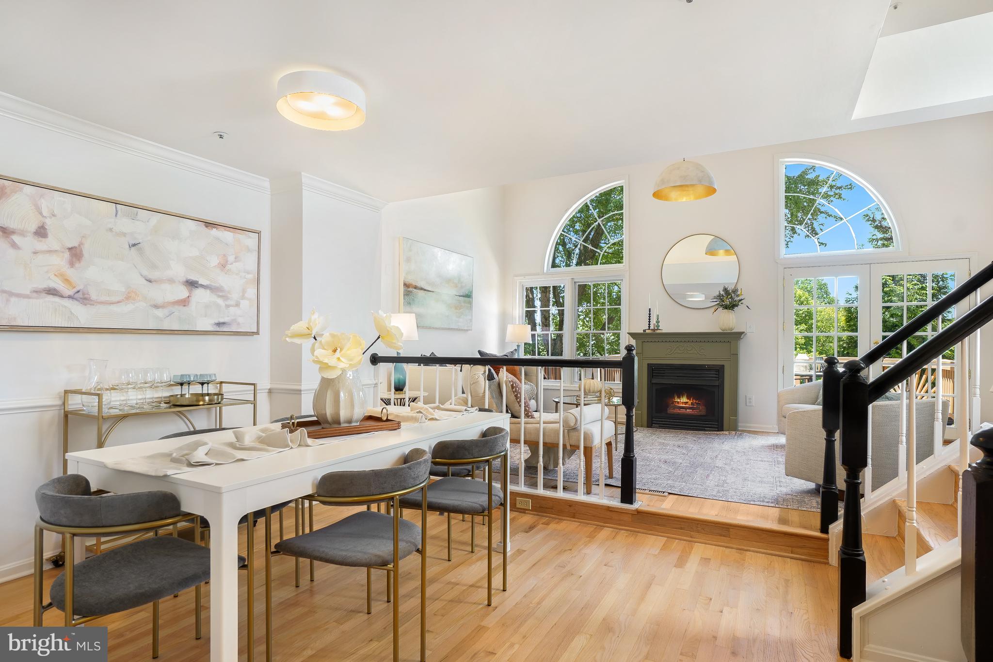 NEW LISTING! Welcome to 2045 Westchester Drive, an exceptional 26 ft wide END-UNIT townhouse offering approximately 2,900 square feet of thoughtfully designed living space across four finished levels. With 3 spacious bedrooms, 3 full baths, and a powder room on the main level, this residence combines the comfort of a single-family home with the convenience of low-maintenance townhouse living. The open and inviting main level features recently refinished solid hardwood floors, an abundance of natural light, updated gourmet EAT-IN KITCHEN, separate DINING ROOM, and step-up living room with 2-STORY CEILINGS, decorative gas fireplace, Palladian windows, and double FRENCH DOORS leading to the REAR DECK. The 2nd level has two bedrooms with their own full bathroom off the hallway. The 3rd level has double doors opening to a spacious California king bed-sized PRIMARY SUITE, a private retreat with VAULTED CEILING, ample closet and storage space, EN SUITE LUXURY designer-renovated PRIMARY BATHROOM recently updated with large format ribbon ceramic wall tile, polished porcelain hexagon mosaic floor tile in the walk-in shower, custom frameless glass shower enclosure, brass fixtures, 12" x 24" porcelain floor tile, 72" freestanding DOUBLE VANITY with white quartz top, undermount ceramic sinks, widespread brass faucets, brass framed vanity mirrors, 3-light chandelier style vanity lights. This spa bath additionally offers a 59" freestanding SOAKING TUB with brushed brass floor-mounted faucet & shower wand, 2 SKYLIGHTS, separate water closet, a WALK-IN CLOSET with built-in closet organizers, LVP flooring at the landing up from the primary bedroom and massive newly-finished STORAGE ROOM. The lower level walkout basement offers space for recreation, a home office, guest suite, fitness, or a media center. This level also has the LAUNDRY room, 3rd full bathroom and a second gas FIREPLACE and access to the REAR BLUESTONE PATIO and backyard for low-maintenance gardening. Multiple levels create distinct living spaces and privacy for all members of the household, perfect for today's modern lifestyle. Attached GARAGE PARKING and driveway for a 2nd parking vehicle complete the package. This rarely available end unit townhome within the Westchester community benefits from extra windows, privacy, and a bright, airy atmosphere throughout. Ideally located near shopping, retail, an abundance of international dining options, grocery, parks & nature trails, commuter routes, and everyday conveniences. Located just a half mile to Wheaton METRO (Red Line) and easy access to the Beltway and I-270 Corridor, this suburban oasis delivers on space, layout, style, and convenience. *all fireplaces are not confirmed to be operable -- buyer to verify*