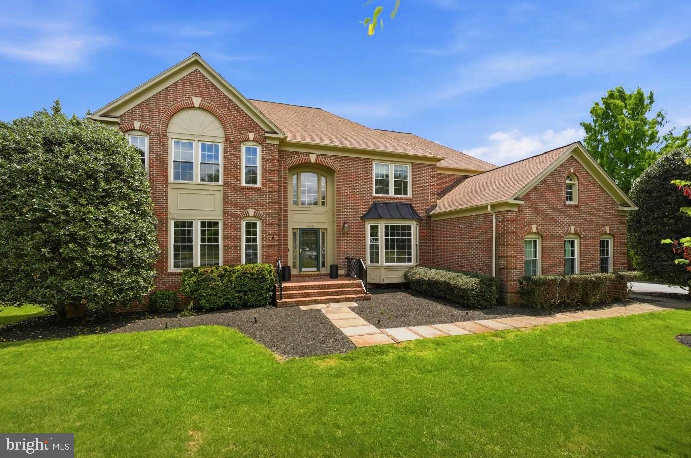 Rare opportunity to own this beautifully updated Colonial in the highly sought-after McLean Hundred community, within the prestigious Langley High School pyramid. Situated on a premium nearly 0.6-acre lot, this elegant brick residence offers approximately 6,200 square feet across three finished levels, featuring 4 bedrooms, 4.5 baths, a walk-out lower level, and a desirable 3-car side-load garage. 

Thoughtfully upgraded (major renovation in 2026) and move-in ready, the home features a reimagined gourmet kitchen, beautifully updated upper-level bathrooms, new hardwood flooring throughout the upper level, fresh interior paint, designer lightling, replacement windows, insulated garage doors, an upgraded sprinkler system, newer upper-level HVAC, and a newer water heater, washer, and dryer.

A grand two-story foyer with a sweeping curved staircase welcomes you into a thoughtfully designed floor plan featuring formal living and dining rooms, a private office with custom built-ins, a bright sunroom, and an expansive family room with a fireplace. The family room opens to a large deck overlooking mature trees and the fully fenced backyard, offering exceptional privacy and room for a future pool.

At the heart of the home, the gourmet kitchen showcases custom cabinetry, quartz countertops, a large center island with a downdraft cooktop, abundant storage, and a sun-filled breakfast area. A main-level laundry room with its own exterior entrance adds everyday convenience.

Upstairs, the luxurious primary suite offers a sitting area, dual walk-in closets, and a spa-inspired bath. An en-suite bedroom with custom built-ins and two additional bedrooms connected by a beautifully updated bath complete the upper level.

The walk-out lower level provides exceptional flexibility with a spacious recreation room featuring a fireplace and bar area, an updated full bath, a bonus room ideal for a home office or gym, and generous open space for entertaining, recreation, or a game room.

Combining timeless architecture, quality upgrades, a premium lot, and an outstanding McLean location, this turnkey residence presents a rare opportunity in one of Northern Virginia's most desirable neighborhoods within the prestigious Langley High School pyramid.