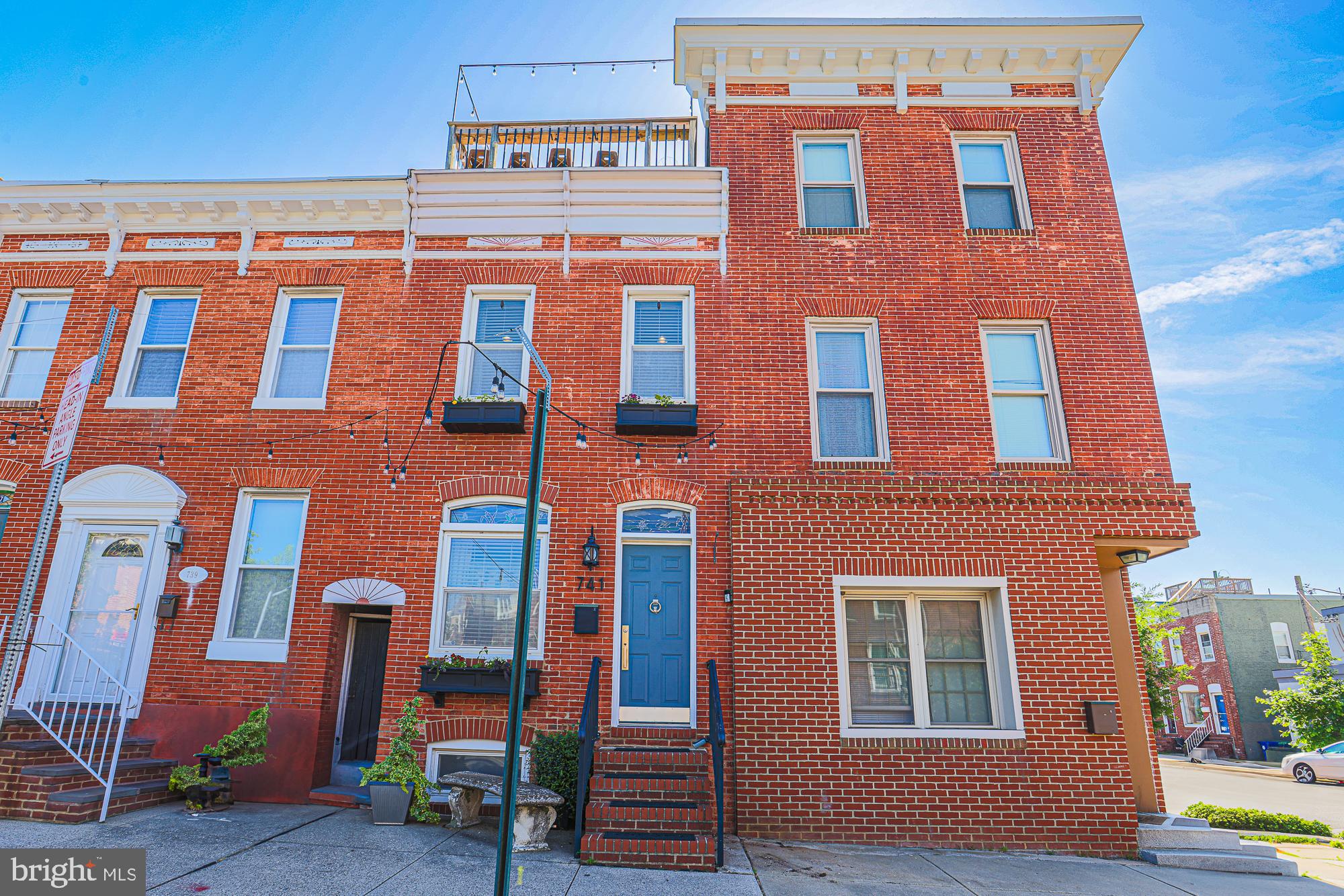 Please bring all offer by 5/16 at 5pm. Sitting 1 house off the corner of a friendly tree lined street in beautiful Canton is this beautiful 2 bedroom 2.5 bathroom townhouse that will be available to show Tuesday 5/13. Located smack dab between Canton Square and Fells Point and just a few blocks from the waterfront this house is just meant for city living with easy access to bars, restaurants, shops and stores. This beautiful townhouse features exposed brick, recently refinished hardwood floors and ceramic tile on the first floor with crown molding and a custom built-in with electric fireplace in the living area to keep you cozy through the winter. The kitchen features beautiful cherry cabinets with granite countertops and stainless appliances with ample space for chefs of any level. In the upstairs you will find 2 bedrooms both with their own bath and a walk-in closet in the master. Just off the master you will also find a nice flex space perfect for a home office or small exercise space. The top feature of this home is its amazing outdoor entertaining space. Step out the back door to find a covered entertainment space with electric fireplace and a projector for beautiful  nights of outdoor movie watching or having friends over for viewing parties. This space also features teak flooring, roll down privacy shades, a covered grill area and a small turf run for dogs or cornhole. 1 flight up you will find a mid level deck with room for a seating area or maybe some urban gardening. Head up one more level and you are on a large rooftop deck. This deck is the perfect place to entertain or just sit at the front ledge and look out over the neighborhood with a piece of the city skyline as your backdrop. Also depending on what time of year it is don’t forget to look for the fireworks that you can see from this amazing rooftop. The basement is technically unfinished but offers up plenty of space for exercise equipment, storage, workshop, or even another home office. Over 100 years old this beautiful city home carries tons of charm and great features in one of Baltimore’s most sought-after neighborhoods.