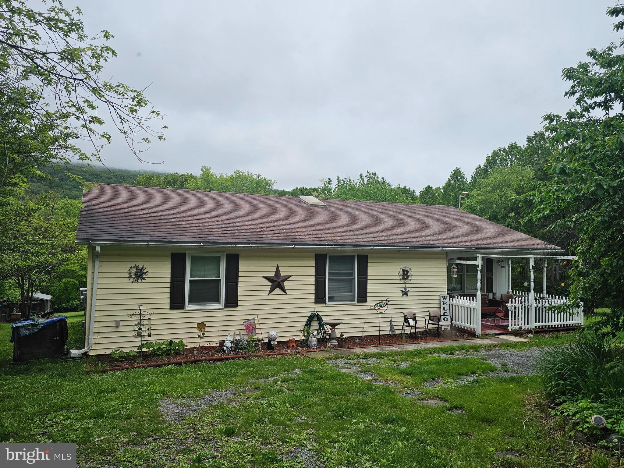 COMING SOON don't hesitate on making an appointment to see this 3-bedroom 2-bathroom rancher on 5.49 acres. This home has plenty of room for entertaining with a kitchen/dining combo which connects to the living room, family room and a 29x12 great room. Home can be one flooring living with the stacked washer/dryer on main floor and an additional washer & dryer in the unfinished basement area.  Enjoy the view from the rear deck of the mountain or the wildlife roaming in your beautiful back yard. Pets, chickens or maybe even a goat if you choose. Plenty of yard space and a fenced garden already in place. Multiple sheds for all your toys and yard equipment. Get your appointment now. Professional Photos Coming Soon