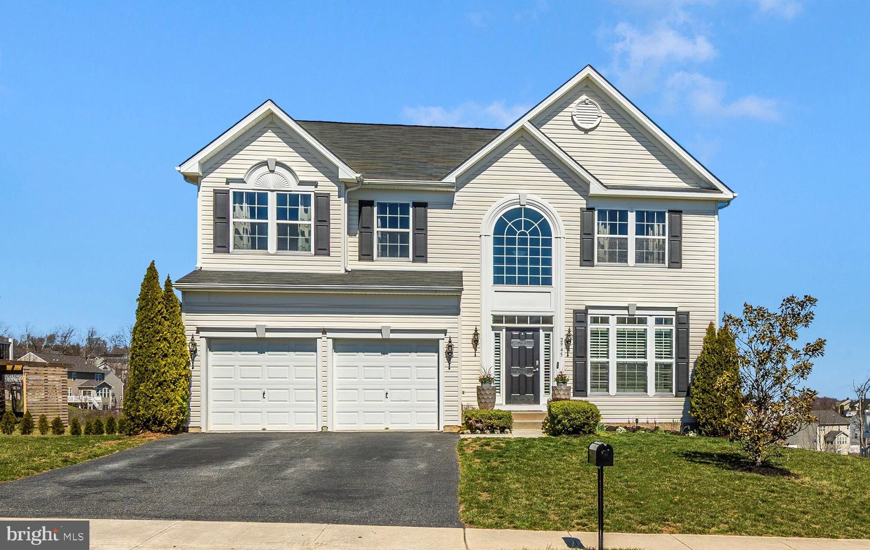 Welcome to this beautifully updated 5-bedroom, 3.5-bath colonial on a premium lot in sought-after Manchester Farms. This move-in ready home features custom high-end finishes and a bright, open-concept layout that blends luxury with comfort.

The main level showcases luxury vinyl plank flooring, a flexible sitting room or home office, elegant dining area, and a spacious living room that flows into a gourmet kitchen with granite countertops, premium stainless-steel appliances, and a generous pantry. A sunroom with built-in bookcases and a cozy banquette opens to an expansive composite deck—ideal for outdoor entertaining. The private backyard, backing to trees and a retention pond, offers serene views and an under-deck storage shed.

Upstairs, the spacious primary suite includes a ensuite bath and walk-in closet. Three additional bedrooms, two with walk-in closets, share a full bathroom. A convenient upstairs laundry room completes the level.

The finished basement features a stylish built-in bar, two-tiered home theater, fifth bedroom, full bath with an infrared sauna, home gym, and walk-out access to a paver patio with firepit and lighting.

Additional features include an attached two-car garage with EV charger, plantation shutters, custom sunroom shades, gas fireplace, new refrigerator (2024), premium Bosch and Frigidaire kitchen appliances, air purifier, whole-house humidifier, attic with flooring and shelving, new hot water heater, energy-efficient ridge vent and attic insulation, invisible pet fence, and professionally maintained lawn since 2014.

Combining upscale finishes with thoughtful upgrades, this exceptional home offers a rare blend of community living and private retreat.