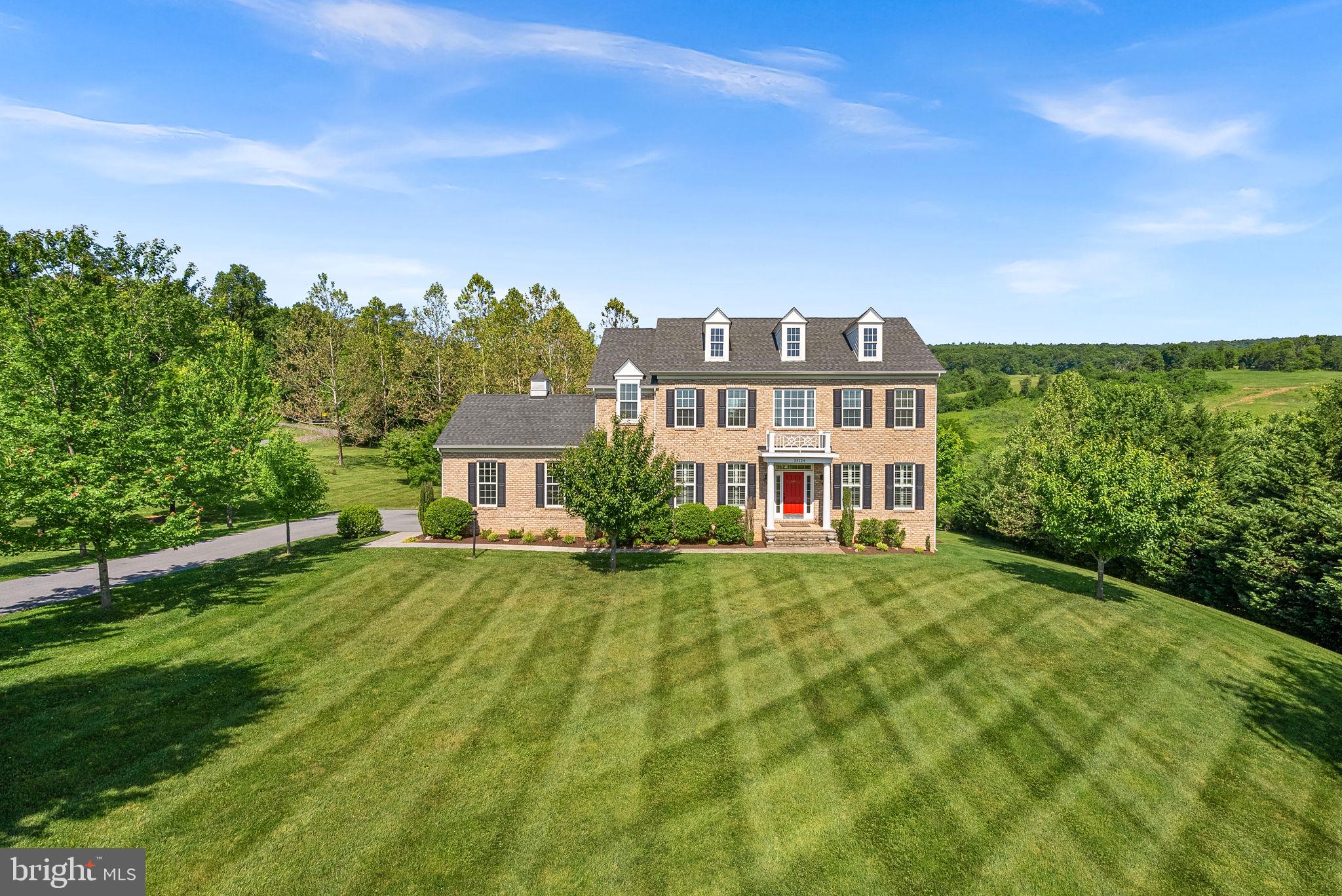 Welcome to 35124 Greyfriar Drive — Where Luxury Meets Nature in Round Hill, VA!  Nestled on over 3 magnificent acres in the heart of Western Loudoun County, this stunning Carrington-built home offers the perfect blend of refined living and natural serenity. With the majority of the acreage stretching out behind the home, enjoy your own private walking trail winding through the property — all backing directly to a 213-acre conservancy lot, meaning your breathtaking views are protected forever.  Boasting over 5,000 finished square feet, this exceptional home features 5 bedrooms, 4 full baths, and 1 half bath with a thoughtful layout designed for both comfortable everyday living and effortless entertaining. The main level offers a versatile bedroom currently used as a home office, paired with a full bath — perfect for guests, multigenerational living, or a dedicated workspace. The freshly painted interior feels bright, clean, and move-in ready throughout.  Step outside to your gorgeous minimal maintenance composite Trex deck with a stairway leading down to the expansive backyard — the ideal setting for morning coffee, evening gatherings, or simply soaking in the peaceful surroundings. Two on-site wells add exceptional utility and self-sufficiency to this already impressive package.  A rare opportunity to own a truly special property where privacy, space, and quality craftsmanship come together — all just minutes from the charming shops, wineries, and amenities of Round Hill and western Loudoun County.  Don't wait and schedule your showing today!