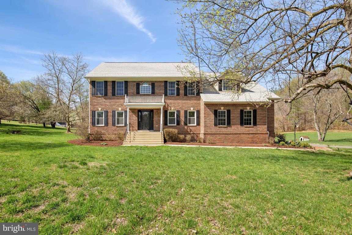 Welcome to this beautifully updated Colonial set on 2.56 pristine acres in Upper Marlboro. Step through a soaring two‐story foyer into an open, inviting floor plan highlighted by refinished hardwood floors throughout the main level and brand‐new windows installed there that enhance both style and energy efficiency. The remodeled kitchen is a chef’s delight, featuring an extended island with seating, a breakfast nook, and stainless steel appliances. Adjacent, the family room offers a cozy gas fireplace, window treatments, a ceiling fan, and recessed lighting—perfect for relaxed gatherings.

The den/office, accented by elegant French doors, provides an ideal space for work or study. Upstairs, enjoy spacious bedrooms, including a luxury owner suite that boasts a cathedral ceiling, dual ceiling fans, a welcoming sitting area with a custom shoe closet, two generous walk-in closets, a private balcony, and an attached spa bath with a jetted tub and dual vanity. An updated upper-level hallway bath also features dual vanity sinks.

Additional modern touches include stylish lighting fixtures in the dining room—complete with a charming bay window—and the powder room, while recessed lighting graces the living room, family room, kitchen, and lower-level rec room. The partially finished basement, upgraded with luxury vinyl plank flooring, offers a den, full bath, and a rec room with a private exit for extra versatility. Additionally, the adjacent utility room can be completed to add extra rooms and/or storage space.

Practical updates abound with a laundry/mud room leading to a two-car, side-load garage, a new roof, and an HVAC system updated within the last 5 years with two-zone control for enhanced comfort. Outside, meticulously landscaped grounds feature mature cherry blossom trees, a large cleared lot with luscious grass, and a raised garden area. This masterpiece perfectly blends timeless elegance with modern conveniences.