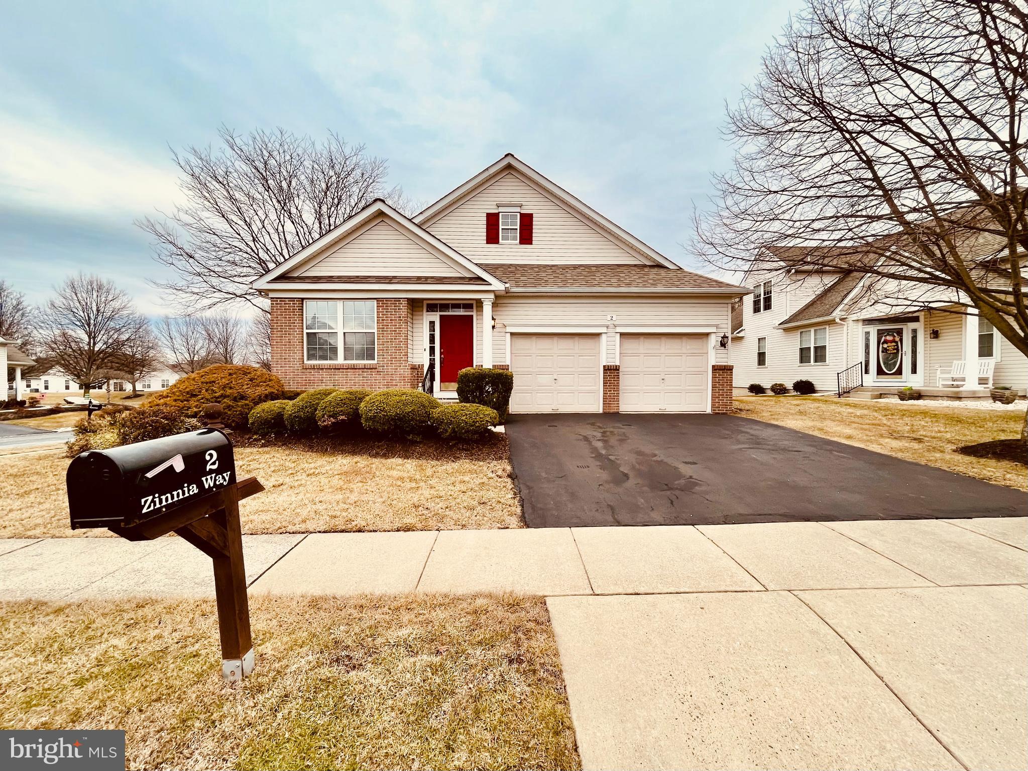 Welcome to 2 Zinnia way in the desirable 55+ Community of Flowers Mill. 
Beautiful ranch home is loaded with upgrades and rests on a premium lot overlooking open space and mature trees. This spacious Tyler model boasts hardwood floors in the foyer, office, kitchen and hallway.
Spacious kitchen, white cabinets with decorative knobs, a Corian island, and countertops.
GE appliances, recessed lighting, and the pantry complete the space. The adjoining family room features a cathedral ceiling with a fan and atrium doors leading to a paver landing and rear yard. The laundry room is equipped with washer, dryer, utility tab, white cabinetry, and access to a two-car garage with a pull down
stairs to lit attic.
Huge unfinished basement provides incredible storage opportunities.
Residents can enjoy the clubhouse, featuring indoor and outdoor swimming pools, a fitness center, game rooms, a library and a variety of activities.
 Ideally located near shopping and dining options, Route One, I-95, the PA Turnpike and top medical facilities.