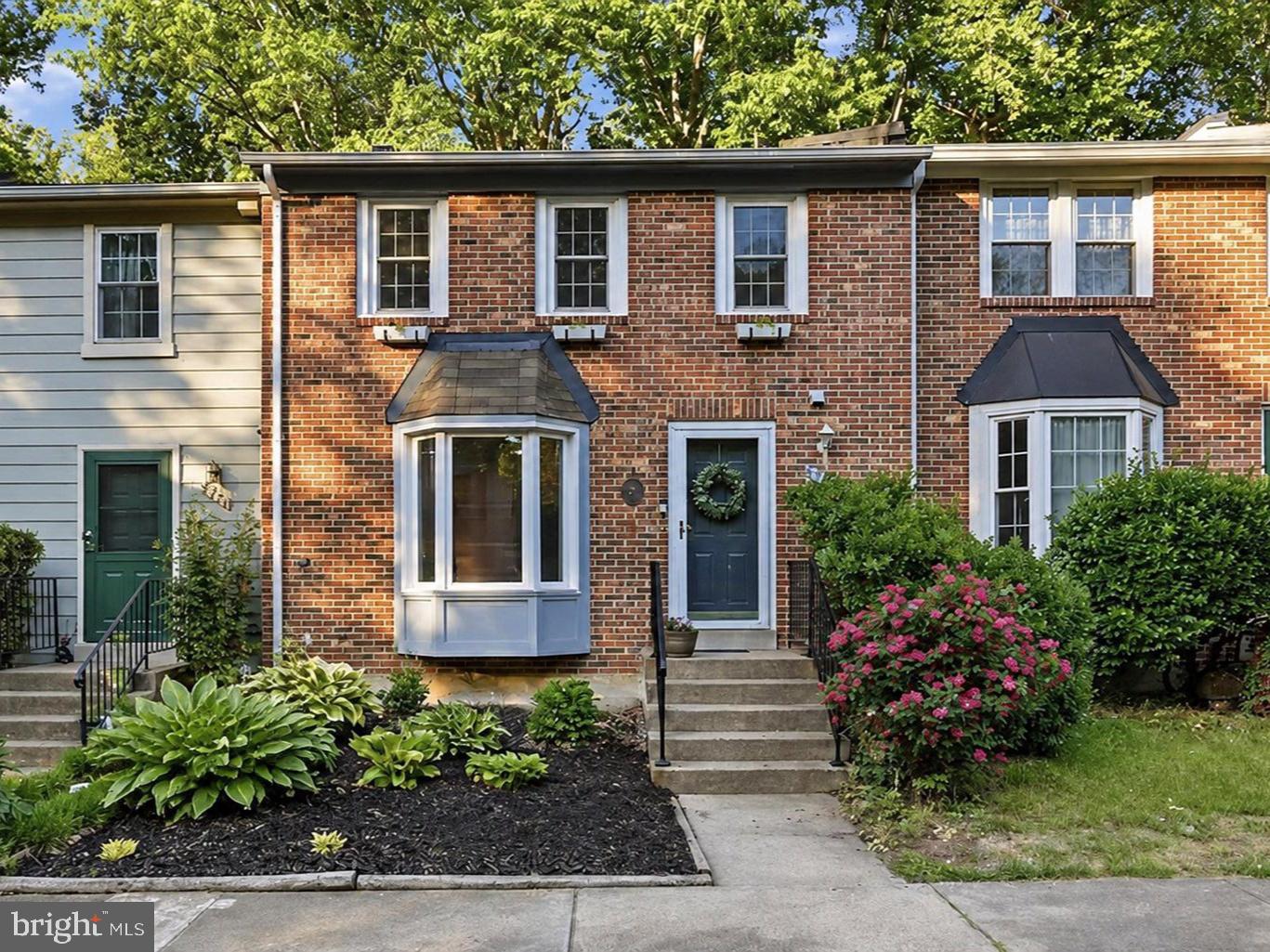 Move-in ready and thoughtfully maintained! Welcome to 5723 Walnut Wood Lane, located in the highly sought-after Burke Centre community in Burke. Nestled in a quiet, established neighborhood with peaceful wooded views, this inviting home offers the perfect balance of comfort, style, and convenience.

Offering over 1,400 square feet of finished living space across three levels, this home features 3 bedrooms, 2 full baths, 1 half bath, and a finished walkout basement that provides exceptional flexibility for a recreation room, home office, gym—or a combination of all three—plus an oversized storage, utility, and laundry area.

Inside, natural light fills the home, creating a warm and welcoming atmosphere throughout. Freshly painted throughout in a neutral color palette, the home feels bright, inviting, and move-in ready. Hardwood flooring extends throughout the main level and is complemented by stylish shiplap accents in the living room and powder room, adding warmth and character. The home offers a comfortable and functional layout designed for both everyday living and entertaining.

Recent improvements include upgraded windows, a newer basement slider and storm door, fresh basement carpeting, and a 2026 hot water heater, offering added comfort and peace of mind. The home also features gutter guards for low-maintenance living.

Step outside to enjoy the fully fenced backyard with peaceful wooded views, complete with an entertainment deck off the walkout basement and a custom landscaped planting area surrounded by a retaining wall—creating a private outdoor retreat.

Parking is convenient with two assigned parking spaces directly in front of the home, abundant visitor parking nearby, and additional street parking for guests.