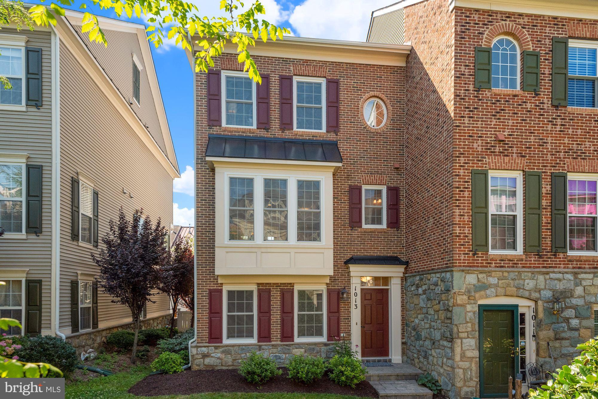 Stunning brick front end-unit townhome in desirable King Farm! Walkable community with numerous amenities including 2 swimming pools, multiple parks, and a Clubhouse. Just minutes to I-270, ICC, and other major commuter routes. Community offers a shuttle directly to Shady Grove Metro station! Mattie Stepanek Park and Dog Park just 2 blocks away from the home with playgrounds, picnic areas, tennis courts, and much more. Just steps to King Farm Village Center with Safeway, Starbucks, and other retail and restaurants. This well maintained home is move-in ready with 2,100 square feet of living space on 3 finished levels including a 2 car garage. Lower level entry with lush courtyard views from your huge rec room and garage access. The main level features wood flooring throughout with an open concept living and dining room. New energy efficient Thompson Creek windows installed throughout the home let in tons of natural light. The living room features high ceilings with beautiful crown molding detail and a cozy gas fireplace. The kitchen features quartz counters, custom cabinetry, gas range, and breakfast bar seating. The kitchen overlooks the large dining room with direct access to your huge back deck perfect for entertaining. The upper bedroom level features a primary bedroom suite with vaulted ceilings, walk-in closet, and ensuite bath with dual sink vanity. Don't miss out on this opportunity!
