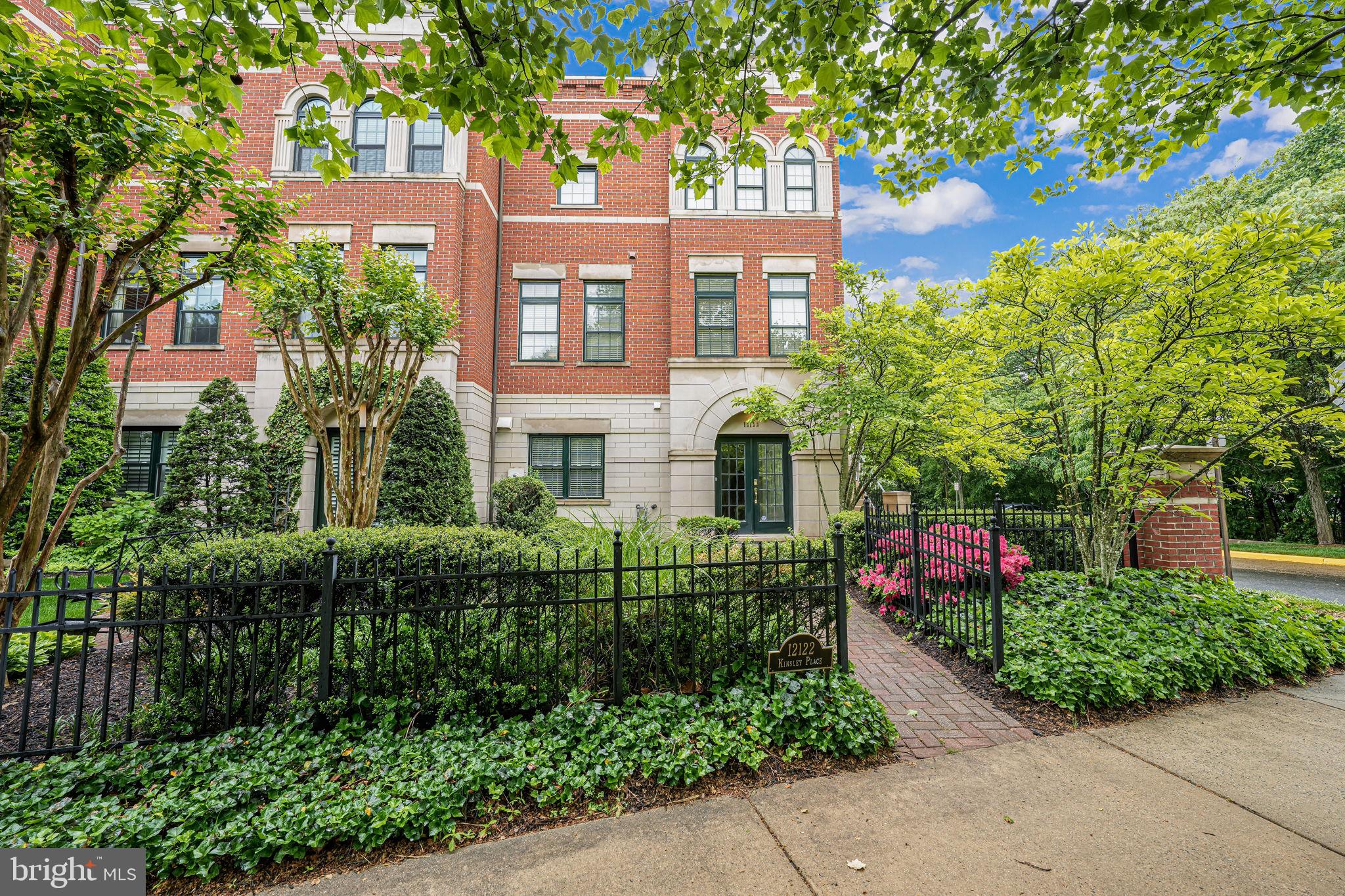 Enjoy the best of Reston Town Center living at Park Place in West Market! Rarely available END UNIT "London" model.  Spacious four level town home with elevator to main level.   The entire unit has been freshly painted with all new carpet installed.    First floor bedroom with fireplace and full bath.  Bright and sunny main level with walls of windows.  Stately family room, dining room and breakfast nook feature three piece crown molding and hardwood floors.  Large kitchen with sprawling granite countertops.  Primary suite with sitting area, spa like bathroom and large, custom, walk in closet.   Secondary bedroom with private bath.  Dramatic stairway leads to large, light filled, loft space with soaring ceilings and  built in beverage bar with granite countertop.  Great for entertaining.  Huge roof top terrace with expansive views.  Large two car garage.  Community pool, gym and clubhouse one block away.  Walkable to Metro station, W&OD Trail, shopping, restaurants and more!