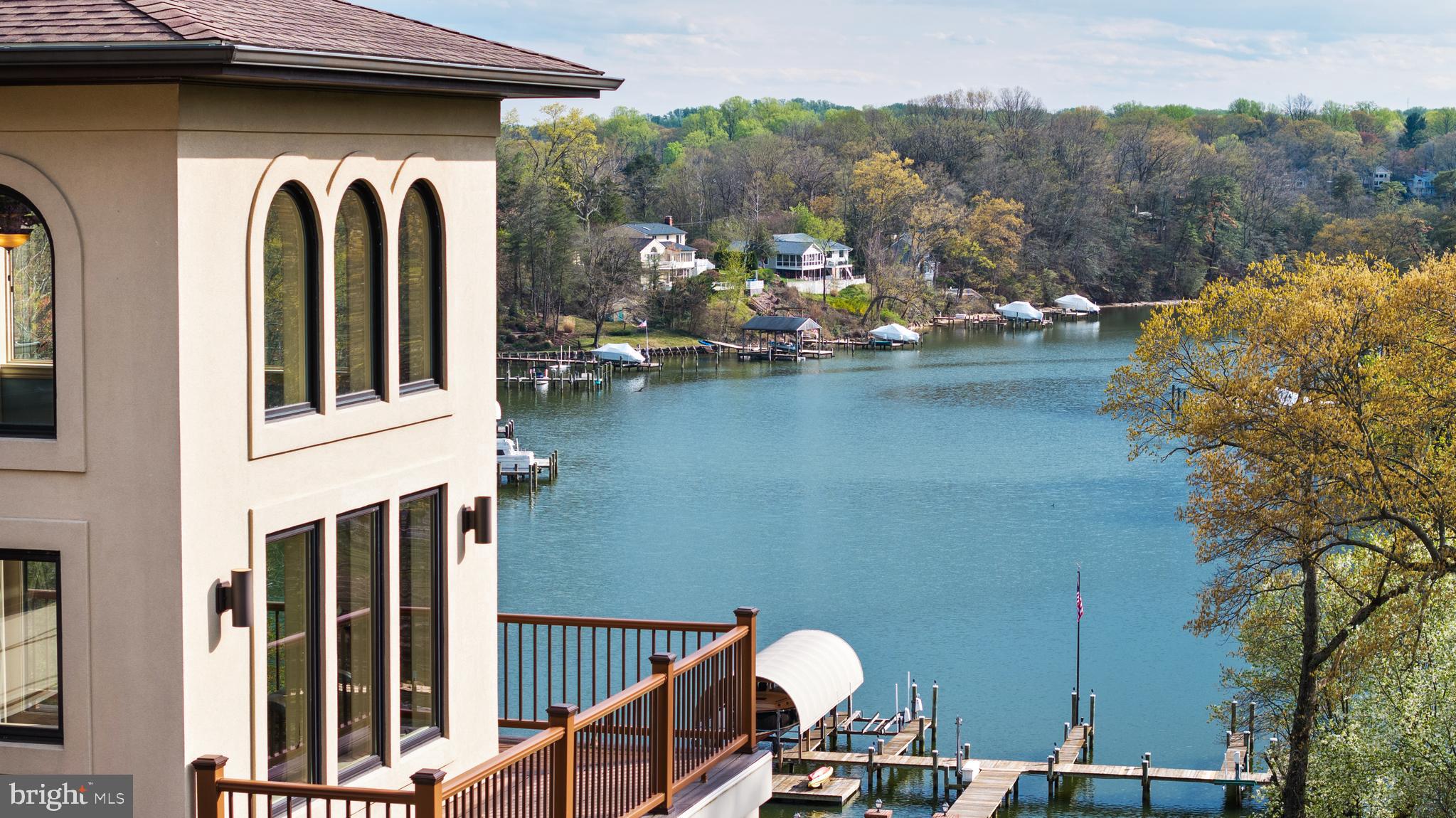 Welcome to this fabulous waterfront estate historically known as The POD.  Set behind the gates of an extraordinary 7+ acre waterfront compound, The POD offers a rare blend of privacy, scale, and resort-caliber living along Forked Creek and the Severn River.  Beautifully constructed and thoughtfully curated, the property unfolds as a true lifestyle destination, where every detail has been designed to elevate both everyday living and grand entertaining. 

A long, illuminated drive framed by mature crape myrtles leads to expansive, meticulously landscaped grounds. Outdoor living takes center stage with sweeping wraparound decks, multiple gathering spaces, and a heated saltwater pool surrounded by travertine stone, gazebo, and fire features. An outdoor kitchen, complete with EVO grill, gas burners, refrigeration, and bar seating, creates the perfect setting for waterfront entertaining, while the year-round spa and low-maintenance turf with putting green enhance the ease of ownership.

The private pier is a standout, offering multiple slips, lifts, floating dock access, and approximately 10 feet of water depth. An exceptional experience that is ideal for boating enthusiasts seeking effortless access to the Severn River and beyond. 

Inside, the main residence spans approximately 8,000 square feet, where refined finishes and architectural details are complemented by a light-filled, flowing layout. A grand foyer introduces the home, leading to elegant living and dining spaces, a chef’s kitchen equipped with premium appliances, and a welcoming sunroom overlooking the pool and waterfront. The main level Primary suite with private balcony, fireplace and spa-like bath is the perfect retreat after a day in the pool or on the water. A conveniently located elevator provides seamless access to all 3 levels. 

Designed for both relaxation and recreation, the lower level transforms into a true entertainment hub, featuring a nightclub-inspired lounge with full bar, a state-of-the-art theater, and dedicated fitness and recreation spaces. Head upstairs where an additional 3 bedrooms, 2 baths and an awe-inspiring office with wrap around deck offer comfort and flexibility for family and guests. A separate guest house offers additional accommodations with its own kitchen, living spaces, 3 bedrooms 2 baths and private comforts, an ideal retreat for extended stays or hosting with ease.

Advanced infrastructure and smart home technology, including whole-house automation, security, generator, and climate systems, ensure modern convenience is fully integrated into this exceptional offering.

The POD is more than a home, it is a private waterfront retreat designed for those who value space, privacy, and a seamless connection to the water. A truly resort-inspired setting, this property offers an unparalleled opportunity to experience the waterfront lifestyle in its most complete and effortless form. Welcome Home!