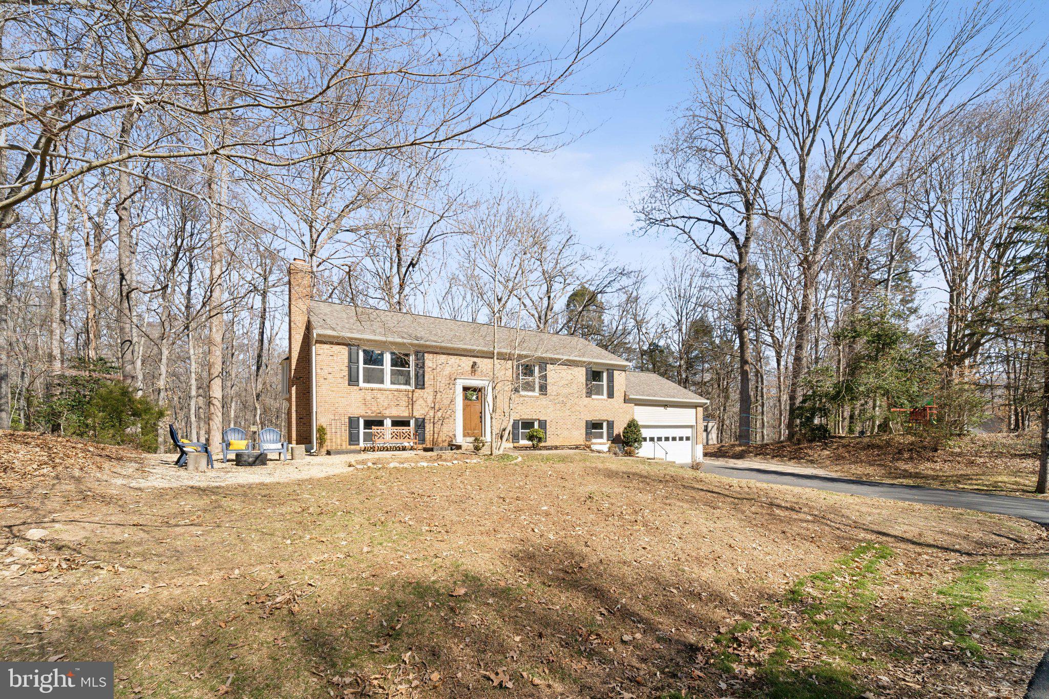 OFFER DEADLINE 03/09 @ 3PM --NEW, NEW, NEW and oh yeah, that's NEW too!  So much done in the last couple of years.  Foyer entry boasts beautiful craftsman style railing with iron balusters.   STUNNING kitchen remodel with 42" white shaker style cabinets and designer two-tone island.  Stone counter tops, patterned tile backsplash, SS appliances, and recessed lighting.  Upper level is open concept to the family room.  Dining area offers a huge bay window and door to newly redone deck with stairs.  Hardwood floors.  Spacious primary bedroom with accent wall.  Updated primary bath with new vanity/toilets and lighting.  Nice sized secondary bedrooms.   New ceiling fans and lighting throughout and shelving in closets. Updated hall bath.  Lower level offers a rec room with newly redone fireplace surround and new flue/damper.  Walk-out level to the new paver/stone patio that wraps around to a sitting/fire-pit area.  HUGE bedroom/in-law suite with updated bath.  Laundry with NEWer washer/dryer and utility sink.  Nice size storage area.  Stay cozy with the NEW HVAC with nest thermostat and NEWer HWH and water softener!  Not to mention NEW attic insulation.  Roof NEW in 2024 along with NEW trim and gutter guards.  NEW exterior lighting and wi-fi garage door.  Large driveway with additional parking space on the side, perfect for your boat or RV.  Private rear yard with shed, playground set, raised garden beds and mature trees.  Recently pumped septic with new lid installed.   Think I got it all, but just so much -- truly move in ready!  Well desired neighborhood in the heart of it all!   List of all upgrades and dates provided.