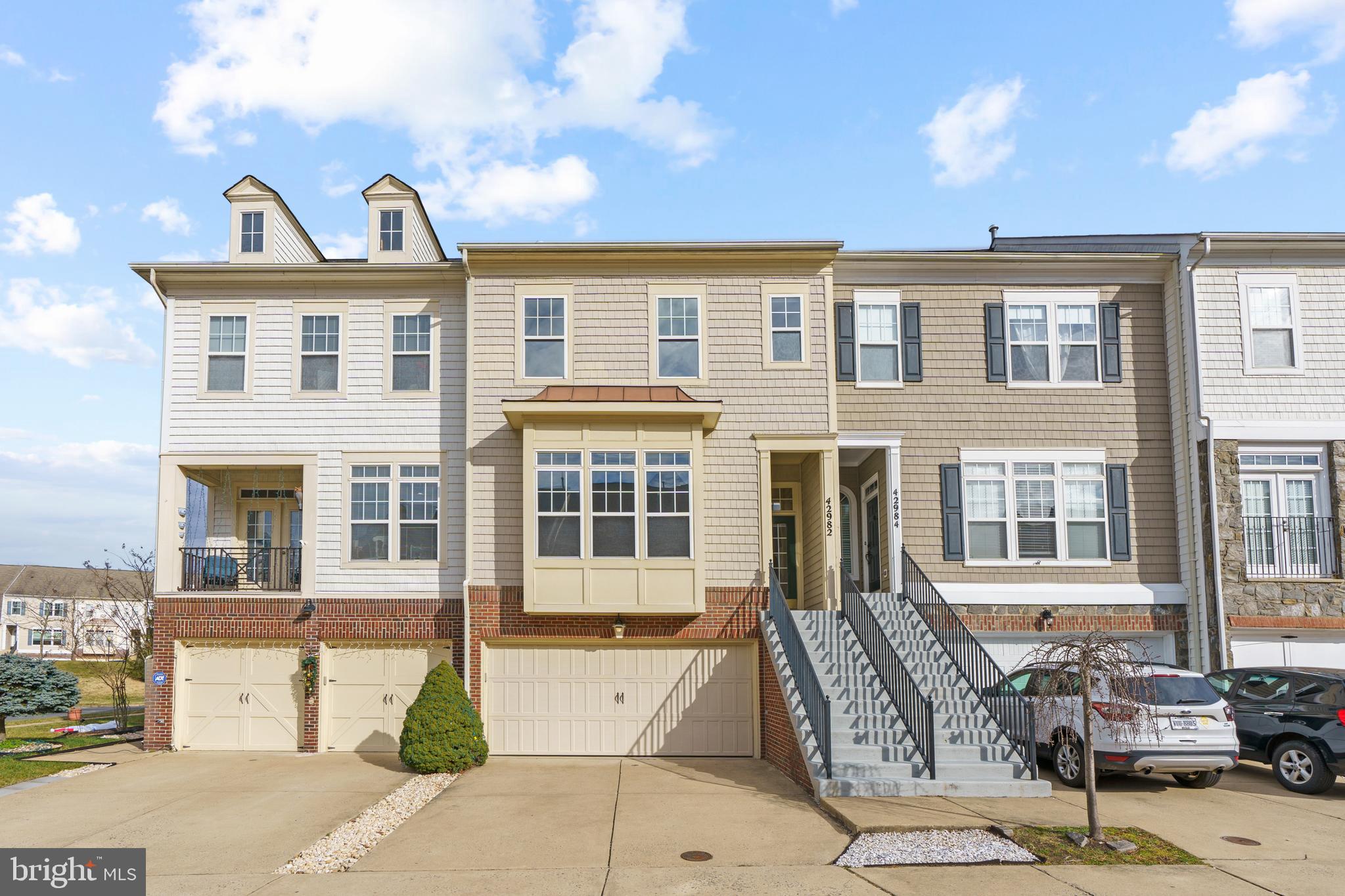 Gorgeous townhouse in sought after picturesque Northlake community in the Lakes at Red Rock!  This beautifully maintained 3 level townhouse with 3 bedrooms, 3.5 bathrooms and 2 car garage has upgrades galore including hardwood on main level, granite in kitchen, luxury tile and granite in all bathrooms, newer plank flooring in lower level.  Fully fenced backyard with stamped patio and retractable awning, perfect for entertaining or peaceful relaxation!  Ceiling fans, shades and LED lights throughout.  Laundry room on bedroom level.  The community offers walking paths, green spaces, and access to the spring-fed lake.  Community amenities include tennis courts, swimming pool and kids playground all within a walking distance to the spring-fed lake.  Conveniently located close to shopping, dining, and entertainment options, with easy access to Route 7, Lansdowne and downtown Leesburg. Only 1 dog under 20 lbs accepted with $500.00 nonrefundable pet deposit and $50.00 pet rent per month.  Sorry, no cats.