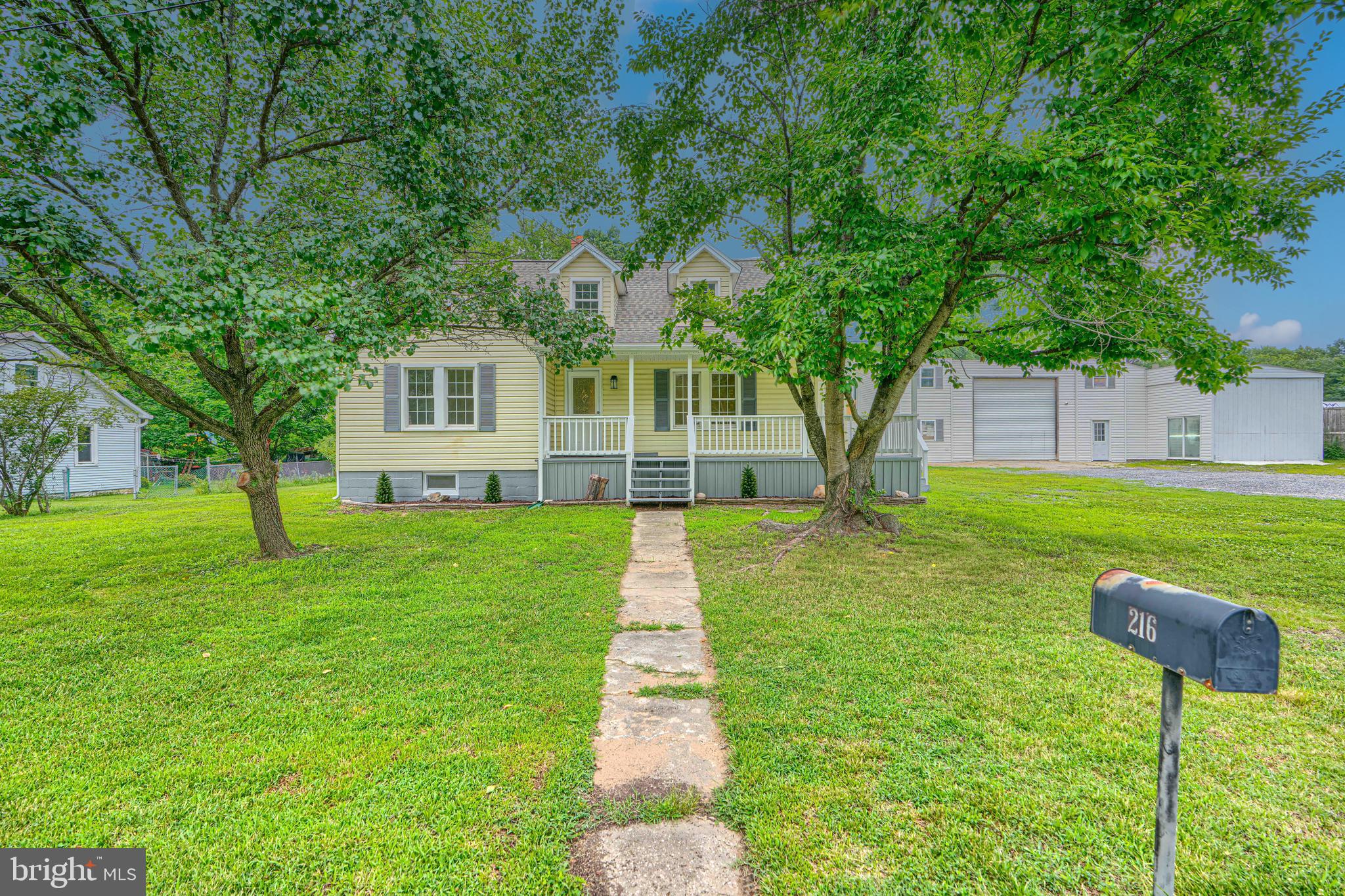 Exceptional opportunity for an investor or owner seeking commercial properties in Anne Arundel County. Built in 1940 with approximately 0.34 acres of lot, this renovated home exudes character with its classic exterior frame and vinyl siding, ensuring durability. The interior features laminate flooring in the main level the flows from the living room to the updated kitchen equipped with white shaker cabinetry, granite countertops, stainless-steel appliances and a sliding door that opens to the sunroom with wonderful view of the backyard. The upper level showcases three spacious bedrooms and two full bathrooms with convenient tub showers, ensuring relaxation and functionality.  The exterior features include a wide enclosed porch, a rear deck and a detached garage that is broken up into 2 units with a bathroom.  The lot features a thoughtfully designed landscape, including a front yard and a partly wooded rear yard, providing both aesthetic appeal and privacy. The expansive outdoor space is perfect for various uses, whether for recreational activities or potential future development. This property is strategically positioned to cater to a variety of commercial needs, with its combination of natural features and practical amenities.