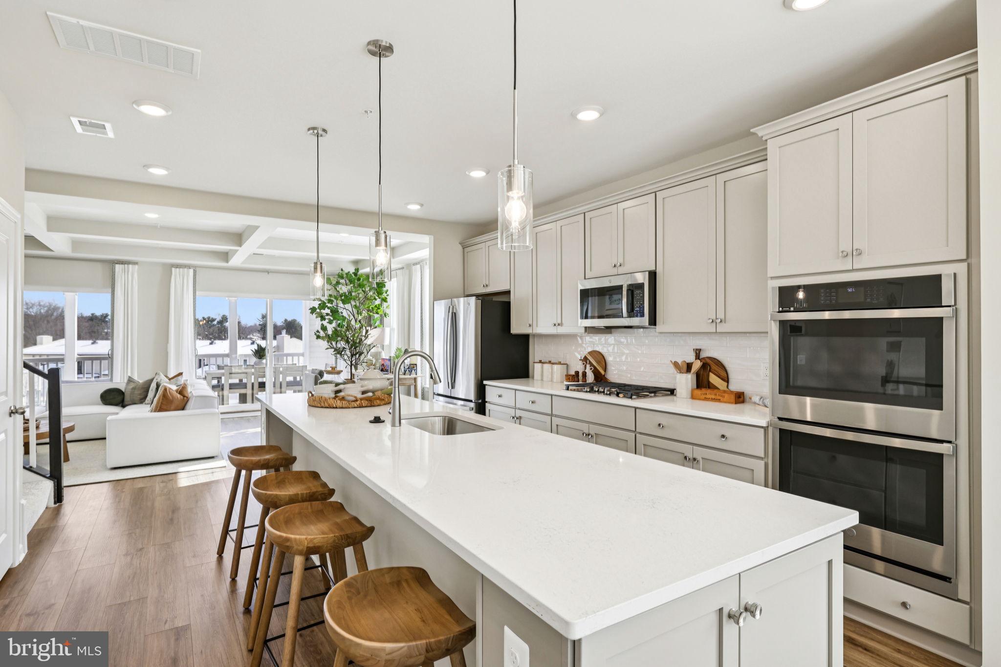 Available in October. The most affordable new construction condo townhomes in Montgomery County! Introducing the Brenn—a stunning 2-level garage townhome condominium, now under construction in the heart of Montgomery Village. Boasting 2,402 sq. ft. of thoughtfully designed living space, this home features 3 bedrooms, 2.5 bathrooms, and an attached garage. Highlights include an open concept kitchen with long island and upgraded appliances, double wall ovens, a coffered-ceiling option in great room, and a gorgeous lanai just off the family room—perfect for indoor/outdoor living. The luxurious primary suite offers a tray ceiling, spa-like bath with dual sinks, and a spacious walk-in closet, while the secondary bath also features dual sinks. With plenty of storage throughout, the Brenn is as functional as it is beautiful. As a resident of Montgomery Village, you’ll enjoy access to an exceptional array of resort-style amenities through the Montgomery Village Foundation, including: 6 community pools 18 tennis courts Volleyball, lacrosse, basketball & soccer courts Amphitheater & cricket field Dog parks & tot lots 330-acre park with lakes, walking & jogging trails All of this within walking distance of shopping, dining, and everyday conveniences. Don’t miss your chance to own one of the most affordable new construction homes in Montgomery County—schedule your tour of the Brenn today! *Photos may not be of actual home. Photos may be of similar home/floorplan if home is under construction or if this is a base price listing.