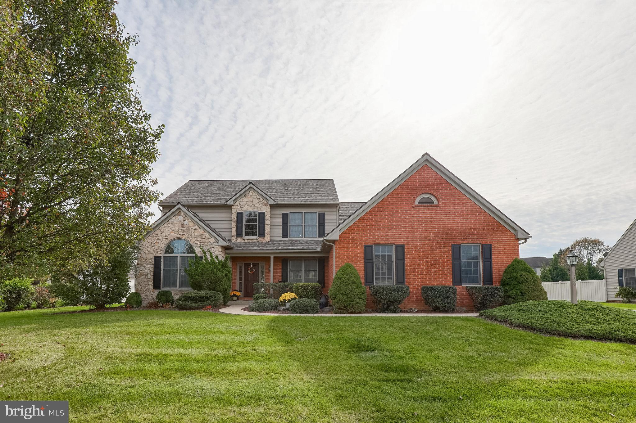 Spacious 6 bedroom home in Manheim Township schools with first floor master suite. Home features hardwood flooring, 2 story foyer, crown moldings and tray and cathedral ceilings. Eat in kitchen with granite, tile backsplash and recessed lighting. Two story family room with fireplace, first floor laundry room and newly finished lower level with bedroom and full bathroom. Rear patio leads to large, flat backyard and new HVAC and roof.