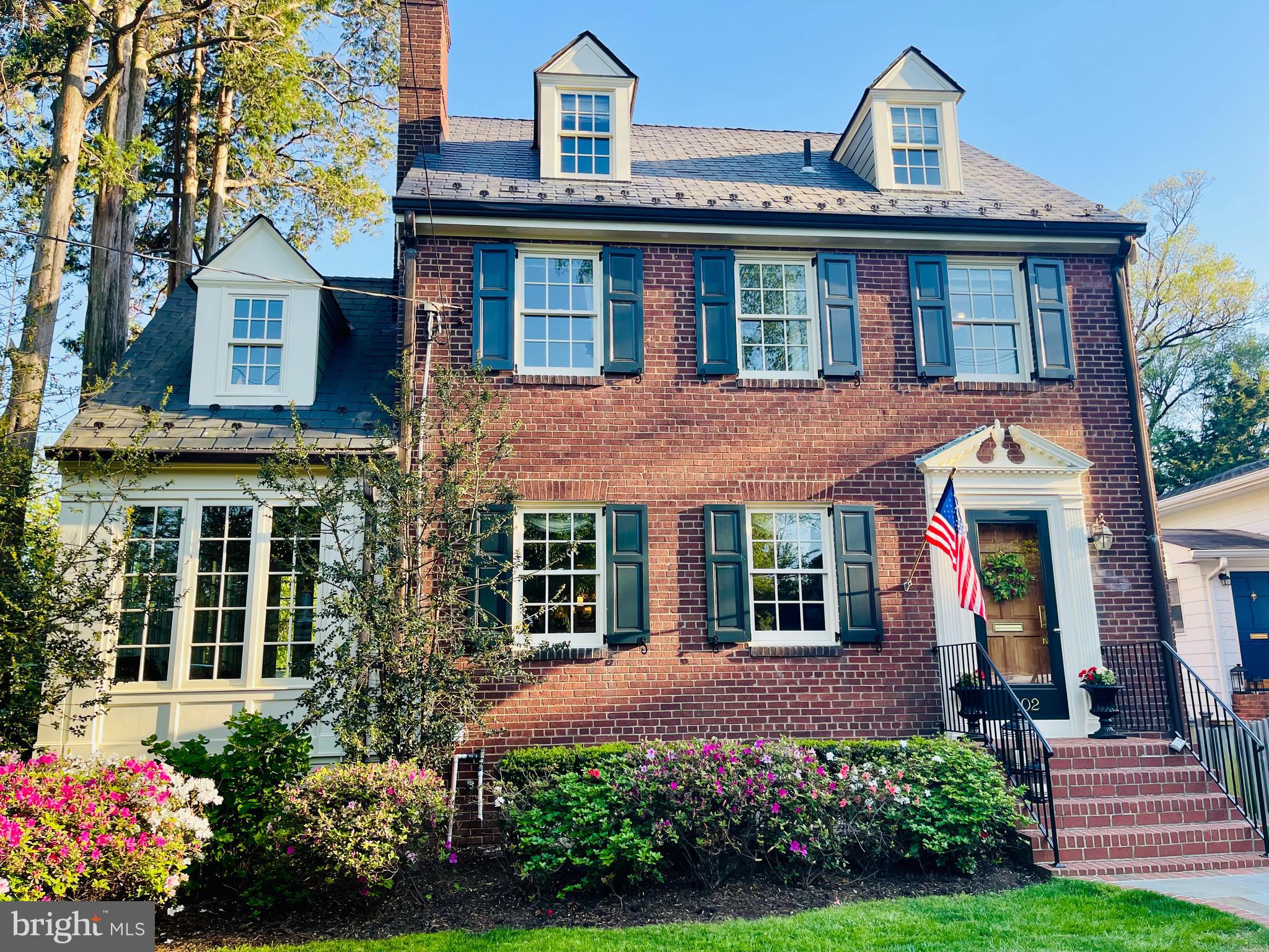 Step into timeless elegance and welcome Spring in this Del Ray masterpiece. This gorgeous, all brick Federal Style home, meticulously curated by the same owners for 30 years, perfectly balances the "charm of yesteryear" with sophisticated updates of today. Inside, four finished levels of living flow effortlessly. The foyer leads you into a stunning living room anchored by a wood burning fireplace and period mantel. From there, retreat to the bright and airy sunroom, your private sanctuary for morning coffee and to enjoy both front and backyard views. The formal dining room is perfect for grand holiday gatherings and seamlessly transitions into a gourmet kitchen featuring custom white cabinetry, quartz countertops, and top tier stainless steel appliances. On the first upper level, discover three elegant bedrooms and a dedicated home office with built-in bookshelves and an expansive custom-built desk area featuring a granite desktop. A full bath completes the first upper level. The entire top level is dedicated to a private primary suite complete with heart pine flooring and a beautifully updated full bath. The fully finished lower level features a large additional living area with a full wall of built-in cabinets and bookshelves, and a full bath and laundry room. Unwind and enjoy the warm months ahead in your private, professionally landscaped backyard oasis complete with a slate patio, stone retaining wall, several flowering gardens, a lush zoysia lawn (with in-ground sprinkler system both front and back), and a custom shed with a dedicated power circuit. The Del Ray location can't be beat – located just a few blocks from the "Avenue" shops, award winning cafes, wellness studios, and popular farmer's market. Easy access to DC, Old Town, 2 metro stations, and only 3 miles from Reagan National airport.