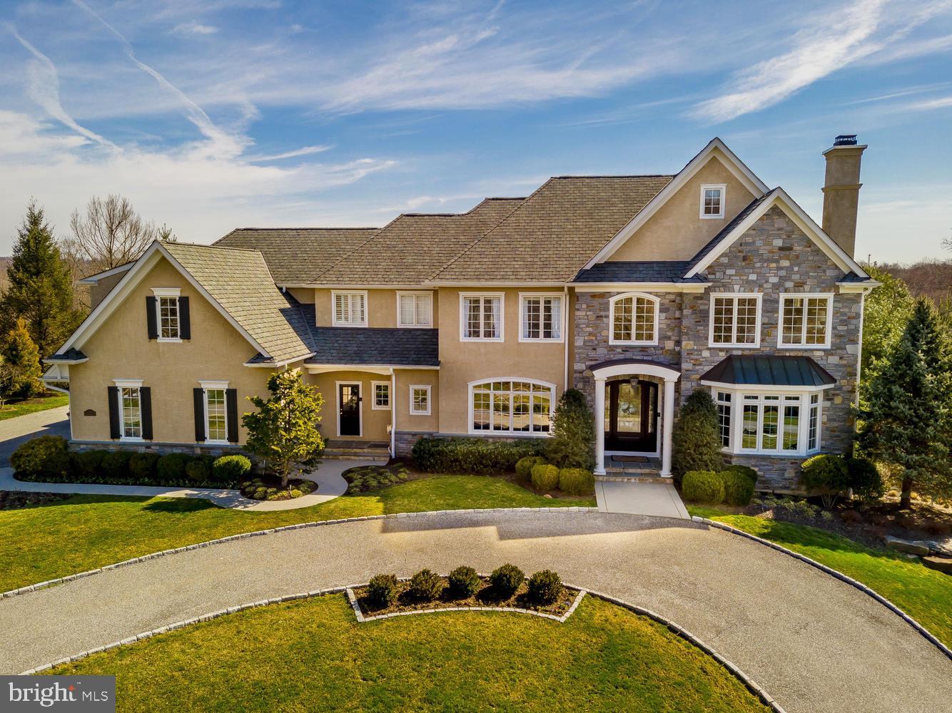 Superb craftsmanship and timeless architecture are unrivaled in this 8,000 sf Moser built estate home nestled on over an acre in the picturesque and prestigious Water Mill community. Sophisticated elegance and style meet the rural surroundings and convenient location with quality appointments throughout this impressive residence.  Extraordinary outdoor living & entertaining areas, easy to use AV systems, elaborate millwork, recess lighting with LEDs and extensive on site hardwood flooring are only the beginning.  A private lane leads to a welcoming circular driveway with meticulous landscaping and stunning front door entrance.  The grand center hall is flanked on the right by the living room with french doors leading to a study with custom built in bookcases with a relaxing sunroom behind; and on the left by the dining room with attractive moldings & butler's pantry. Custom chef's kitchen is the heart of the home with an abundance of glazed cabinetry, granite & limestone countertops with decorative tile backsplash, farmhouse sink, commercial grade appliances and a center island.  This inviting open floorplan is spacious yet intimate, providing a wonderful flow from the warmth of the kitchen & light filled breakfast room into the oversized family room with vaulted ceilings, fireplace and built in entertainment center. An organizational area, command center and two powder room's complete this Level. Retreat to the luxurious Owner's Suite with a dressing area & two walk-in closets with custom organizers. The spa like bath boasts his & hers vanities with limestone counters, a soaking tub, walk in tiled shower with body jets and a private water closet. There are four additional bedrooms: 2 bedroom suites with a private bath and 2 bedrooms that share a bath Jack n Jill style, upper floor laundry room with wash tub and folding counter and loft/reading nook complete the upper level. Spectacular finished walkout lower level offers another entertainment/gathering area with cherry floors, gas fireplace, custom bar, 600 bottle temperature controlled wine room, home gym, sound proof music room and 2nd laundry room. There are several private outdoor living spaces on the flagstone patios with an entrance from the main level of the house or the lower level.  Pick your perfect place for morning coffee, afternoon BBQ s, or just relax and enjoy watching a game on the outdoor TV under the pergola or listen to your favorite genre on the outdoor speakers.  The beautiful gunite pool is heated and has a waterfall and hot tub that is always the perfect aquamarine color! This striking setting is  enhanced by the pristine gardens and natural stone wall accents! This home has been meticulously maintained and is for the discriminating buyer who wants EVERYTHING conveniently located to the most sought after locations ...  Downtown Media, the Main Line, Center City, Philadelphia Airport & sports complexes.  Award winning Rose Tree Media schools along with some of the best private schools in the area which are in close proximity (Episcopal Academy & Baldwin).  Plenty of boutique shops, restaurants, Whole Foods Market & Starbucks are just mins away.  4 car garage, zoned HVAC (NEW furnace 2018), generator, irrigation System. PLUS   All appliances, window treatments, pool/patio furniture and planters, and AV equipment will remain with the house!  What more could you ask for?