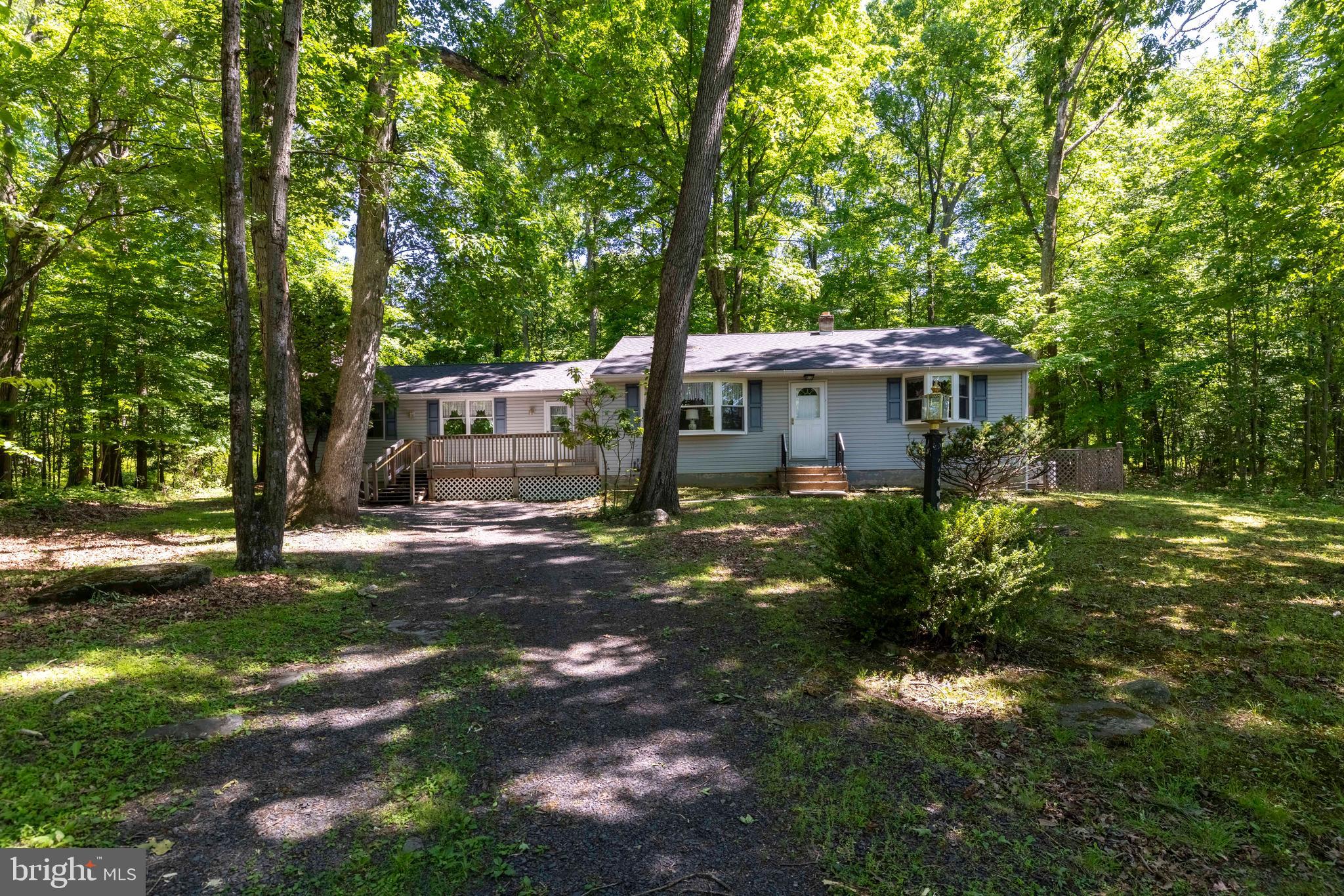 Pride of ownership shines throughout this lovingly maintained one-owner, 3-bedroom ranch home situated on a picturesque half-acre lot in the highly desirable Central Bucks School District.
Step inside to find a spacious family room featuring a cozy stone, wood-burning fireplace, with beautiful built in cabinetry on either side, creating the perfect setting for relaxing. Enjoy the serene backyard from the wall of windows, or step out on to the deck for additional entertaining space. An updated half bath completes this space.
The kitchen is equipped with newer appliances and offers a bay window providing natural sunlight.  Off the kitchen is a large living room or could also be used as a dining room.  3 ample size bedrooms share the large full bathroom with step in shower. One bedroom currently holds the washer and dryer, but there is also a hook up in the basement as well.
Enjoy peaceful mornings and quiet evenings on the serene backyard deck overlooking the expansive yard, providing plenty of space for outdoor activities, gardening, or simply enjoying nature.
Additional features include an unfinished basement with abundant storage or room for a work bench, a newer roof, and a whole-house generator for added comfort and peace of mind.
This well-cared-for home offers the perfect combination of comfort, space, and location. Don’t miss this rare opportunity to own in this sought-after community. Schedule your tour today!