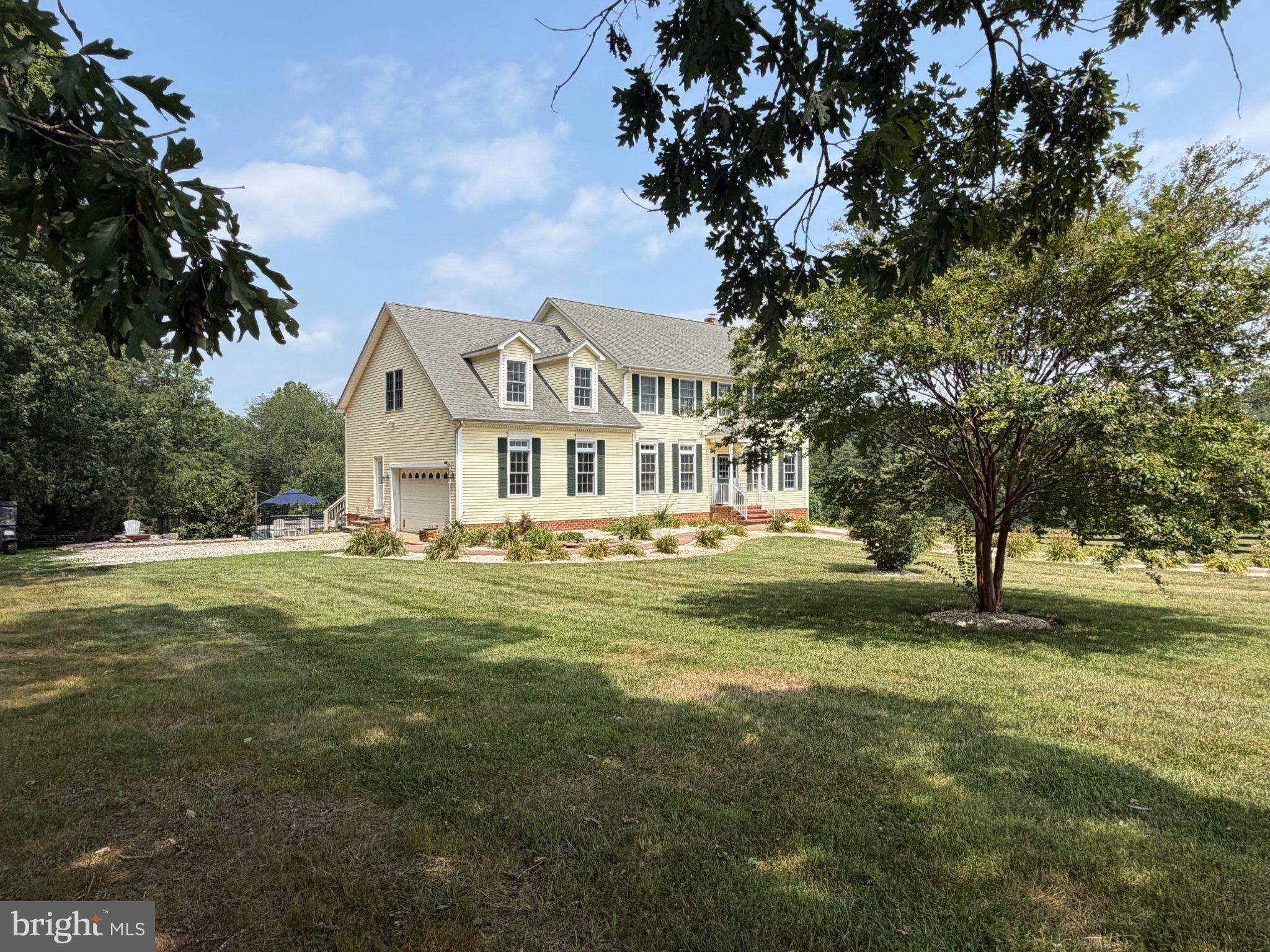 Discover this lovely 4-bedroom, 2-full and 2-half bath farm, nestled on a 45.16-acre lot with open pastures and some woods. The den sits just off the kitchen and has a wood burning fireplace. There is a large screened porch off of the kitchen.  Great for entertaining. In the upper level, you will find four bedrooms and two full baths, laundry room and a large game room or whatever you would like to make it! The lower level has several rooms that could be used as an office, storage or hobby room. The half bath could be converted to a full bath. The walk out basement gives easy access to the professionally installed classic inground fenced pool. Geothermal heat and a whole house generator included! The property is equipped with horse amenities -  including four stall center aisle, and attached large run-in shed. Multiple paddocks. Additional structures include a machine shed and "man cave" with wood burning stove and heat pump. Experience serene views of pastures and wooded landscapes, ensuring privacy and tranquility. The property features a circular gravel driveway and an attached side-entry garage, enhancing convenience. Embrace an exclusive lifestyle in this remarkable estate, where every detail has been thoughtfully curated for comfort and elegance.
