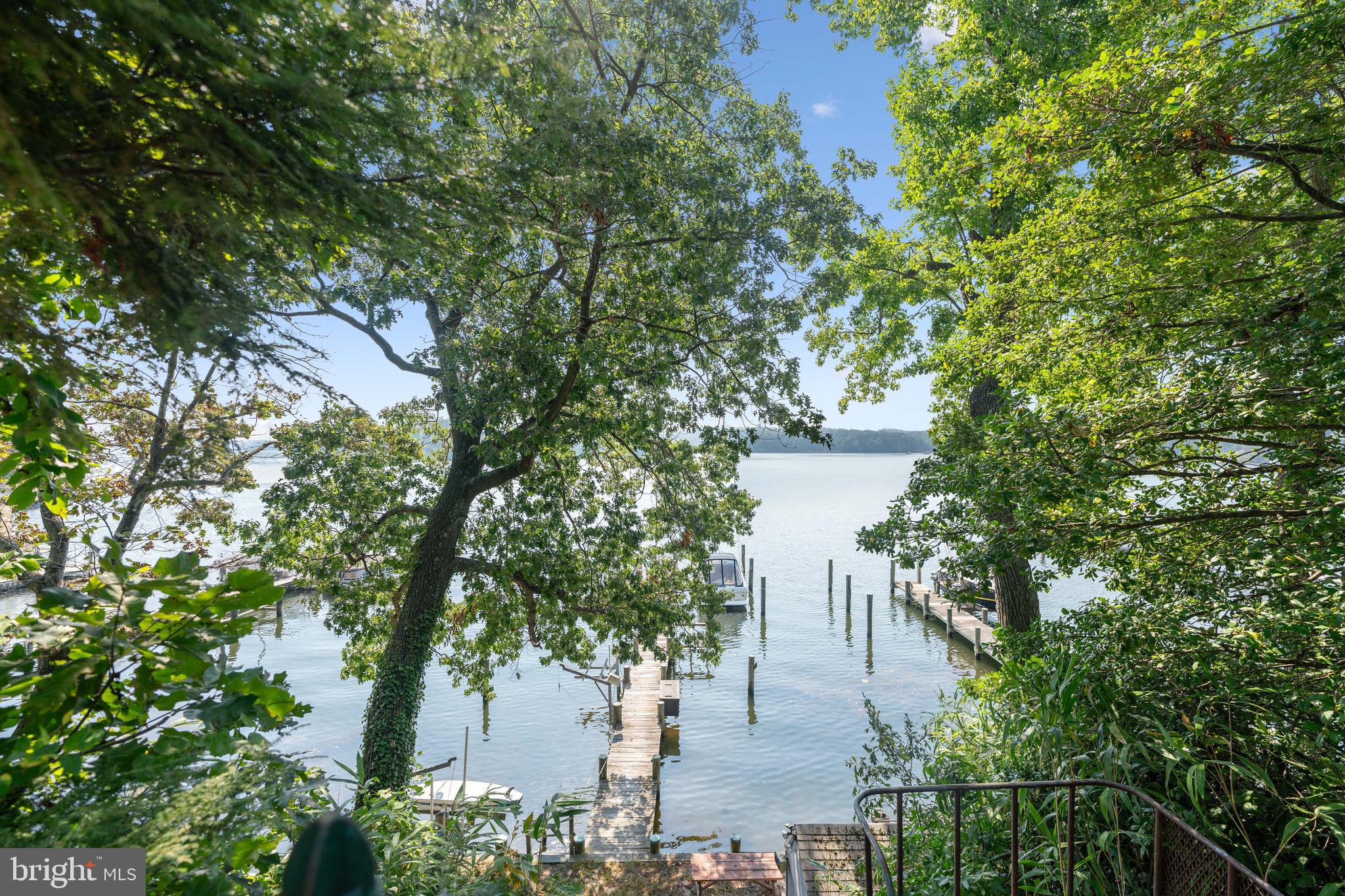 Welcome to Herald Harbor on the Severn River! This waterfront home offers an exceptional living experience with its stunning views and convenient amenities. 
ONLY HALF OF THE LOT SHOWS UP ON PUBLIC RECORDS!

One of the standout features of this property is its deep water pier, ski lift, boat lift, and slide. Water enthusiasts will find endless enjoyment right at their doorstep. 

Inside, you'll find a beautifully designed custom kitchen with cabinets and granite countertops, providing a perfect space for culinary endeavors. The family room, has  a cozy fireplace awaits, creating a warm and inviting ambiance.

The home features two spacious bedrooms and two baths, ensuring comfort and privacy for all residents. 

Additionally, there is a screened porch off the kitchen, offering a tranquil spot to enjoy a morning cup of coffee or unwind after a long day. A patio off the family room provides an ideal space for outdoor entertaining and relaxation, allowing you to fully embrace the waterfront lifestyle.

Whether you're seeking a peaceful retreat or a place to entertain family and friends, this home in Herald Harbor is an excellent choice. Don't miss out on the opportunity to own this waterfront gem!