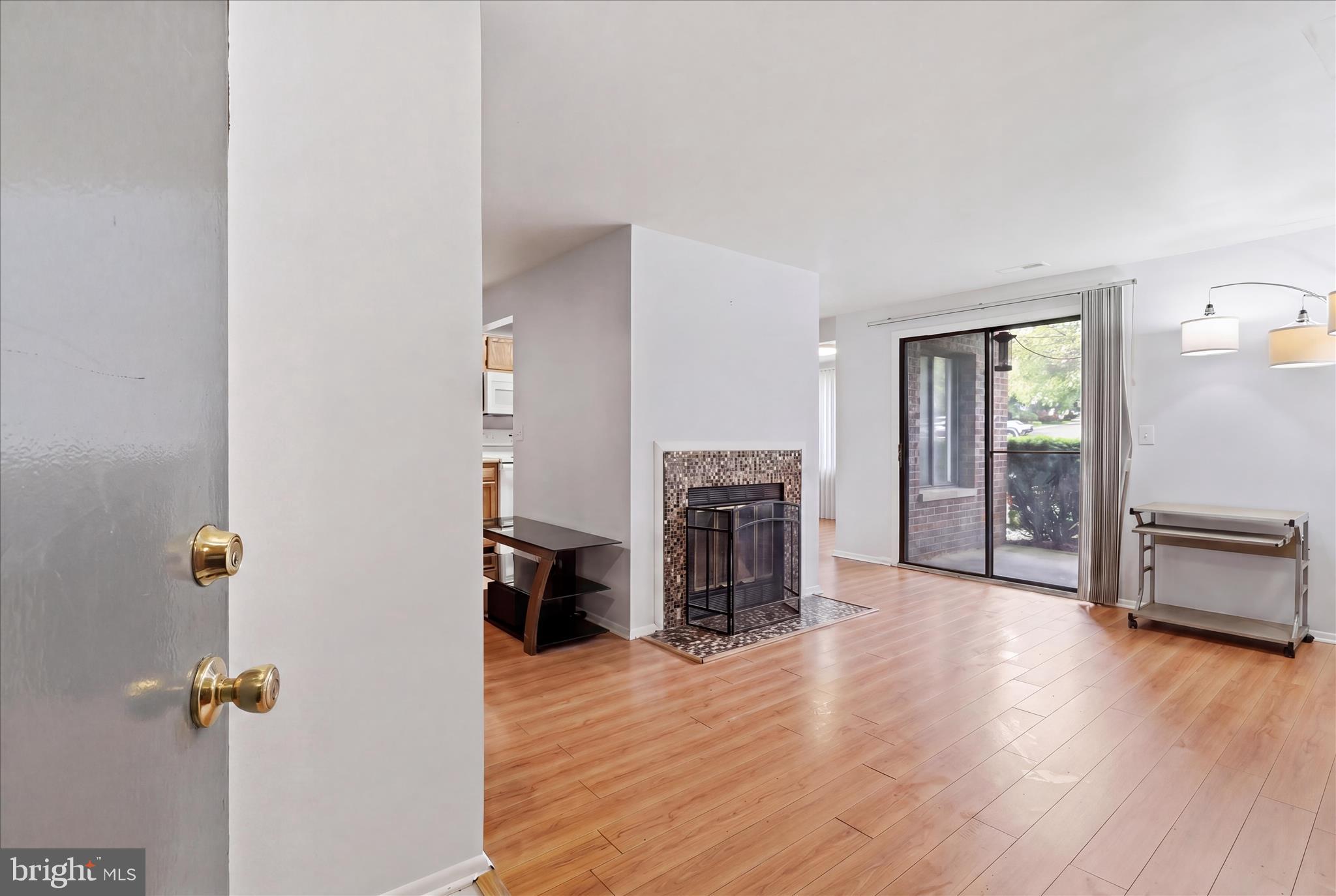 Very Well Maintained first  floor brick presentation condo with views from all windows. Positioned beautifully in the back of the neighborhood with peace & quiet enjoyment. 2 bedroom/2 baths with updated bathrooms, matching full size appliances, flooring and interior paint for your consideration. The primary bedroom offers its own private bath and walk in closet while the other bedroom is conveniently across the hallway. Spacious living area does fit a sectional for cozy recreation area along with a fireplace sitting area for chilly evenings or just the ambience. The kitchen is sweet and simple with newer matching appliances. The kitchen and dining area leads to your front facing patio that offers space and storage for quiet enjoyment or a quick potty for the pooch. Enjoy all Germantown has to offer being near schools, shopping, commuter routes, bus lines and professional  centers.