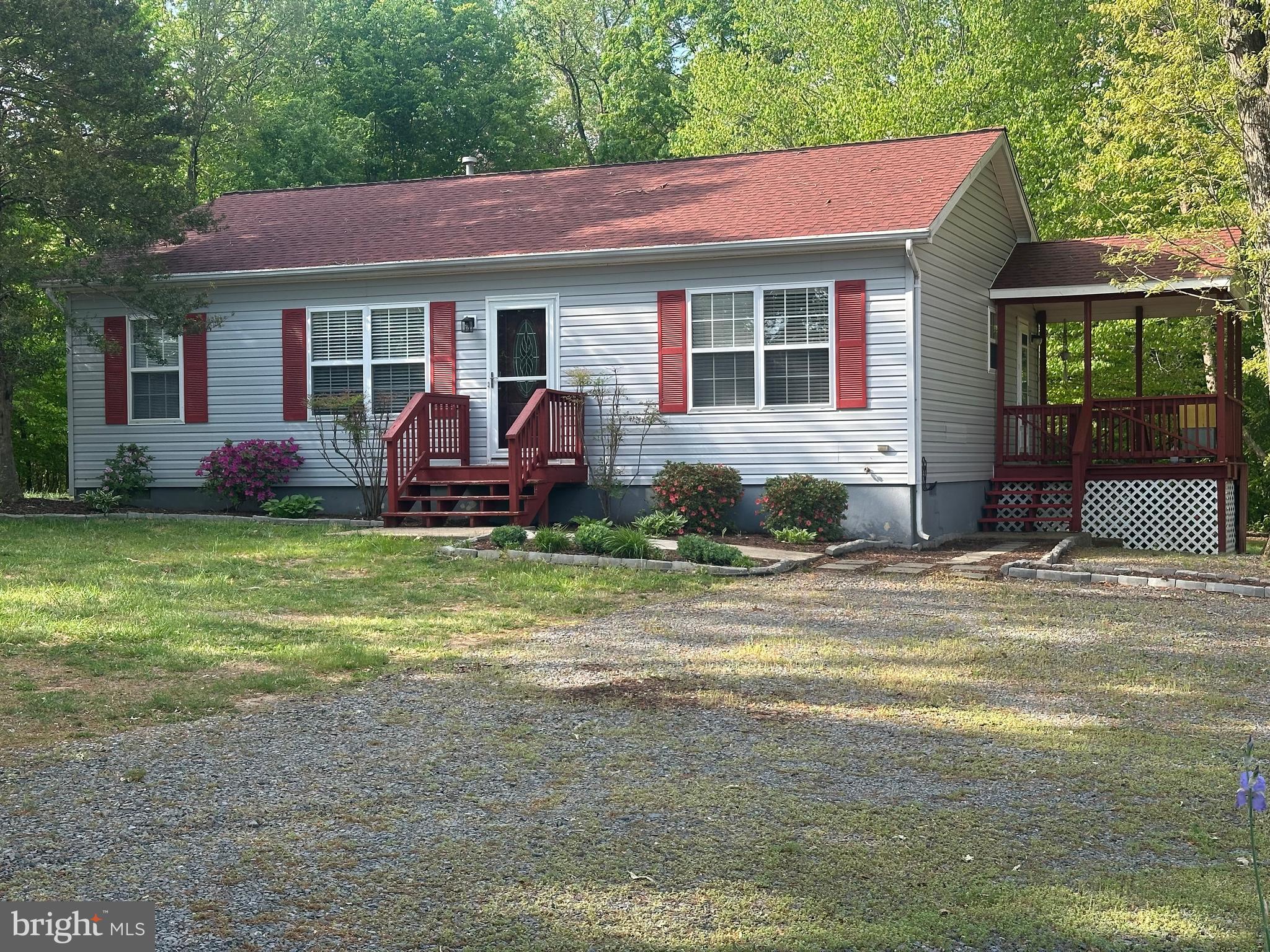 Well maintained, one-level home sited privately amongst mature trees a good distance from the road. Master Bed Room and bath and on opposite end of the home from the two bedrooms and bathroom. Deck off mud room/laundry for quiet mornings over coffee or winding down in the evening. Conveniently located a few miles from Culpeper and Orange.
The white, gambrel roof shed stays, the smaller shed will be removed.