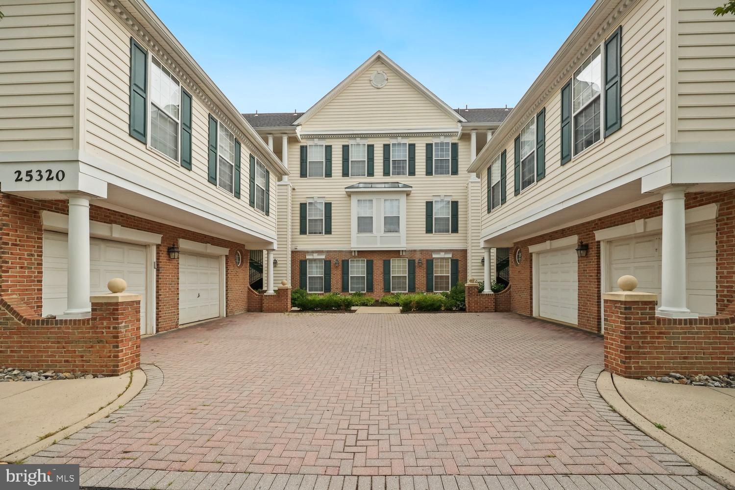 Welcome home to this spacious upper-level Carlyle II model offering one level living with 1,322 square feet of thoughtfully designed living space and the convenience of direct access to a one-car garage from within the unit—perfect for staying comfortable during cold or inclement weather. 
Ideally located within walking distance of South Riding Town Center and just minutes from Tall Cedars, Dulles International Airport, shopping, dining, and major commuter routes, this home also includes access to South Riding's exceptional community amenities through the condo fee. 
Inside, you'll find a bright eat-in kitchen featuring a charming bay window that fills the space with natural light. The versatile floor plan offers two generously sized bedrooms, a separate den, and a bonus room ideal for a home office, guest space, or hobby area. Five ceiling fans throughout the home enhance comfort year-round, while a private balcony provides the perfect spot to relax and unwind. The spacious primary suite overlooks the lake, offering beautiful water views and a peaceful retreat. The luxurious bath features a two-person jetted soaking tub, a separate shower, and ample space to start and end your day in comfort. Combining scenic views, flexible living spaces, and an unbeatable location, this well-maintained home is the perfect blend of convenience, comfort, and style.