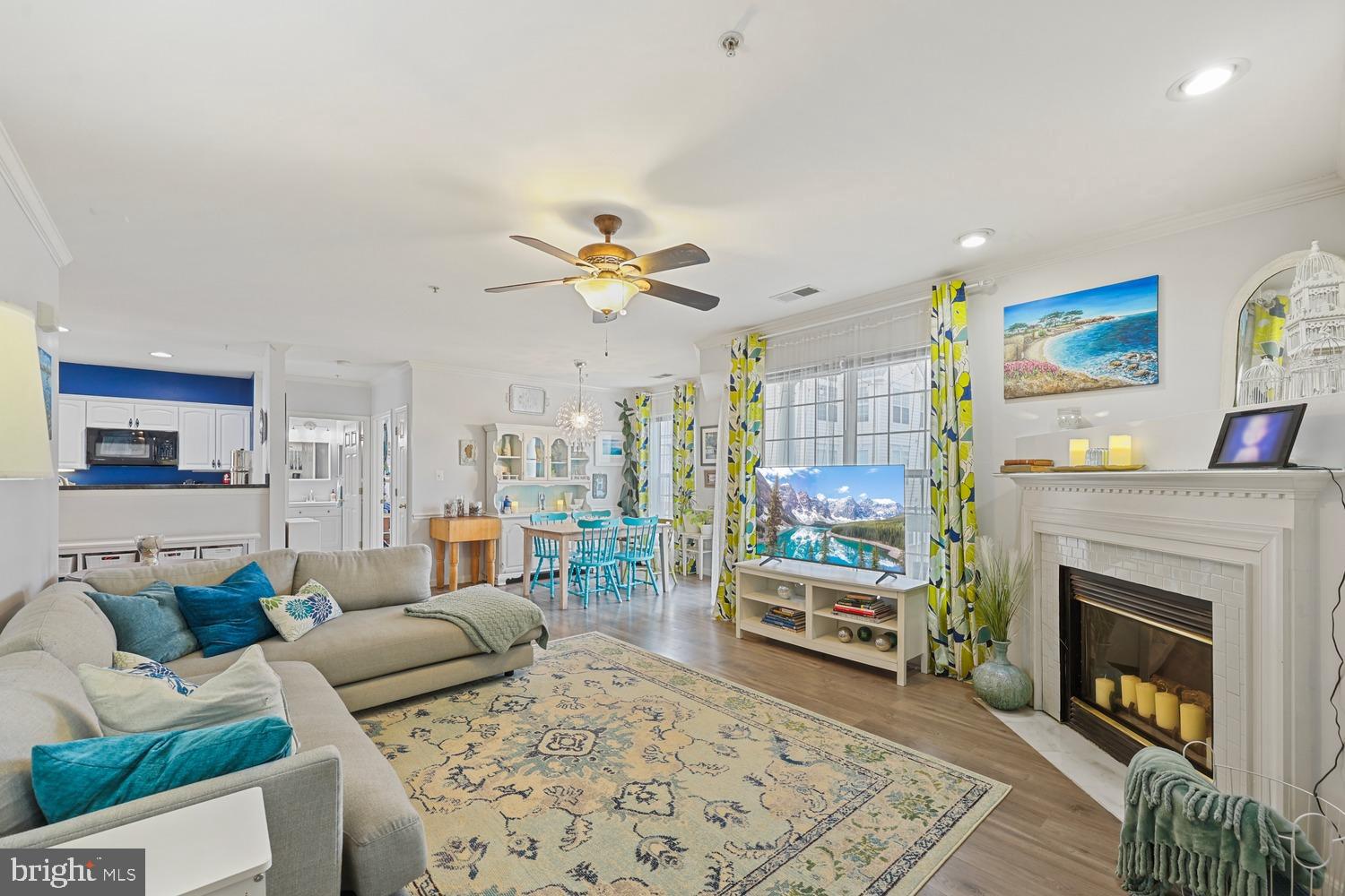 Welcome home to this spacious upper-level Carlyle II model offering one level living with 1,322 square feet of thoughtfully designed living space and the convenience of direct access to a one-car garage from within the unit—perfect for staying comfortable during cold or inclement weather. 
Ideally located within walking distance of South Riding Town Center and just minutes from Tall Cedars, Dulles International Airport, shopping, dining, and major commuter routes, this home also includes access to South Riding's exceptional community amenities through the condo fee. 
Inside, you'll find a bright eat-in kitchen featuring a charming bay window that fills the space with natural light. The versatile floor plan offers two generously sized bedrooms, a separate den, and a bonus room ideal for a home office, guest space, or hobby area. Five ceiling fans throughout the home enhance comfort year-round, while a private balcony provides the perfect spot to relax and unwind. The spacious primary suite overlooks the lake, offering beautiful water views and a peaceful retreat. The luxurious bath features a two-person jetted soaking tub, a separate shower, and ample space to start and end your day in comfort. Combining scenic views, flexible living spaces, and an unbeatable location, this well-maintained home is the perfect blend of convenience, comfort, and style.