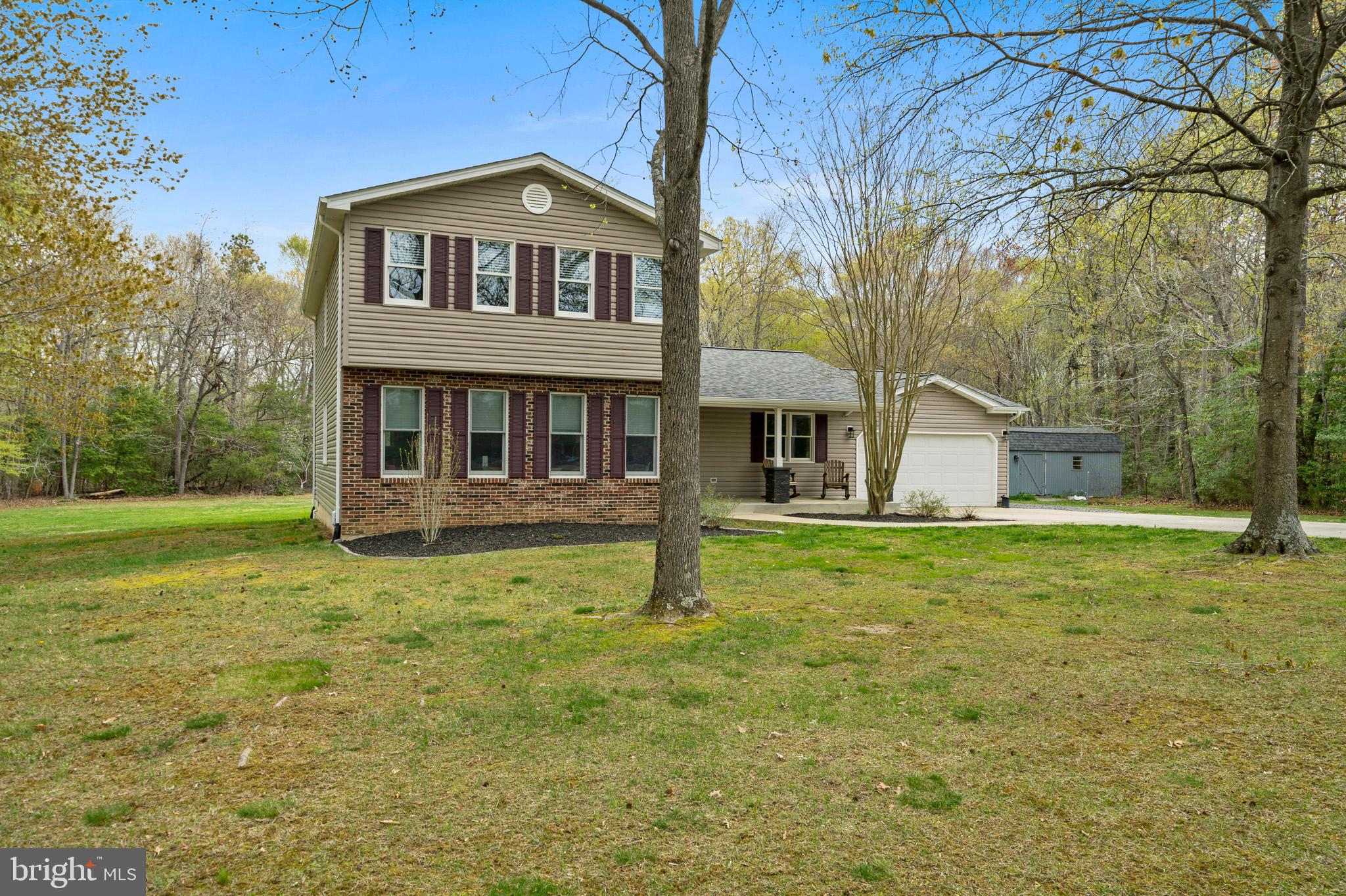 This beautifully updated home features a brand-new  HVAC SYSTEM with 10 year warranty, new hotwater heater, new roof, gutters, downspouts, siding, windows, doors, and skylights, offering both style and peace of mind. Inside, you’ll find a spacious formal living room and dining room, perfect for hosting guests. The kitchen is a chef’s dream, equipped with custom cabinetry, a convenient spice door, a center island, a pantry with roll-out shelving, and both under-cabinet and recessed lighting. The family room, complete with a cozy fireplace, is ideal for relaxation. Throughout the home, stylish Hunter ceiling fans provide comfort in every room.

Step outside and enjoy the serene covered front porch, a large deck for entertaining, and a generously sized shed for all your storage needs. The two-car attached garage comes with a super-quiet opener for added convenience. Nestled on a peaceful cul-de-sac with no through traffic, this home sits on over 2 acres of private, flat land—offering endless possibilities for gardens, a pool, and more.

Combining modern updates with tranquility and privacy, this home is an exceptional find. Don't miss out on the opportunity to make it yours!