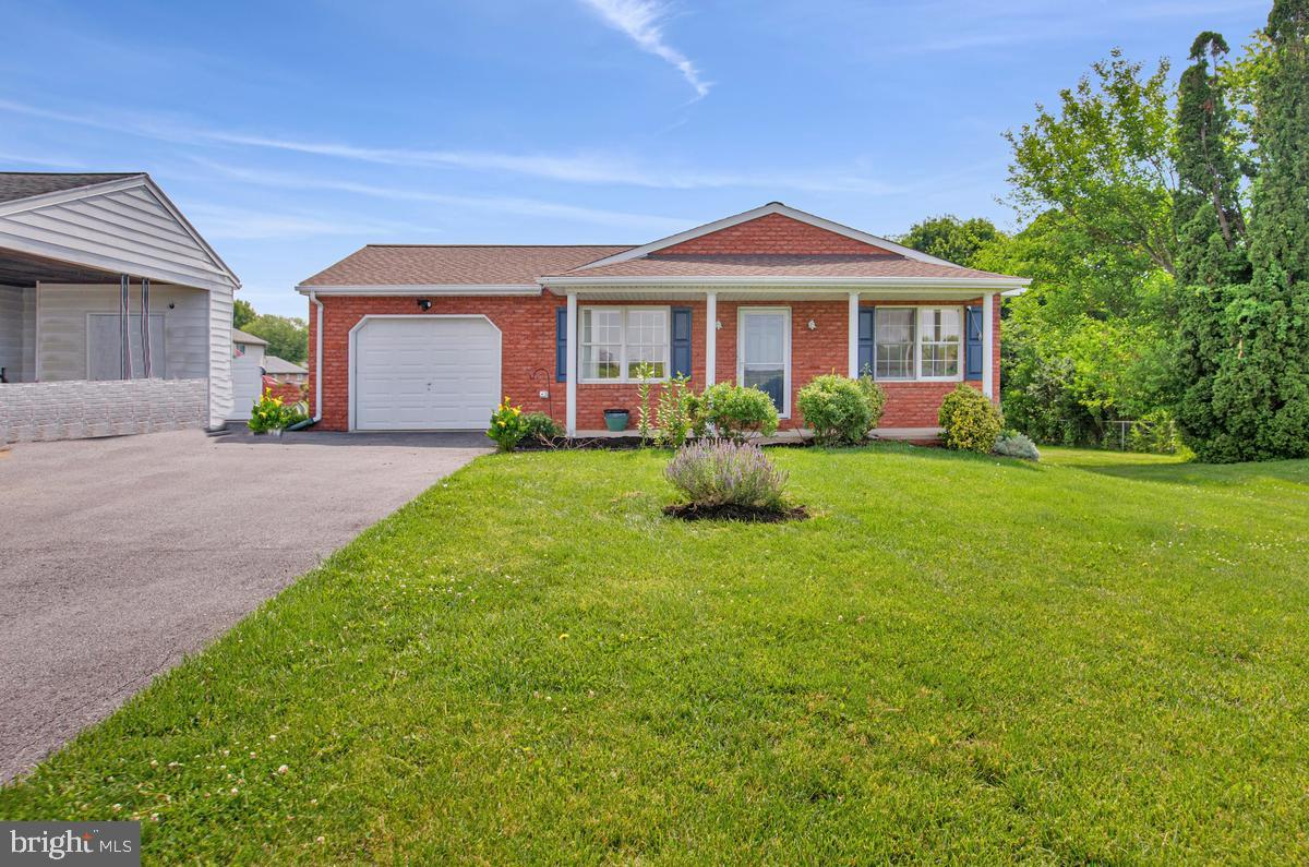 Beautifully maintained 3BR, 2BA rancher with a fully finished basement, 1-car garage, and parking for up to 4 vehicles. Situated on a level .37-acre lot overlooking scenic farmland, this home features an open-concept layout, updated kitchen with island for breakfast bar, stainless steel appliances, skylight, laminate flooring, spacious owner's suite with walk-in closet, and a fully finished lower level. Recent improvements include a 2026 kitchen renovation, bathroom flooring upgrades, 2022 roof, newer hot water heater, HVAC service (2026), and septic inspection (2025). Enjoy ample backyard space for gardening, beautifully manicured  and open front yard outdoor space, and peaceful country views while being just minutes from shopping and everyday conveniences.