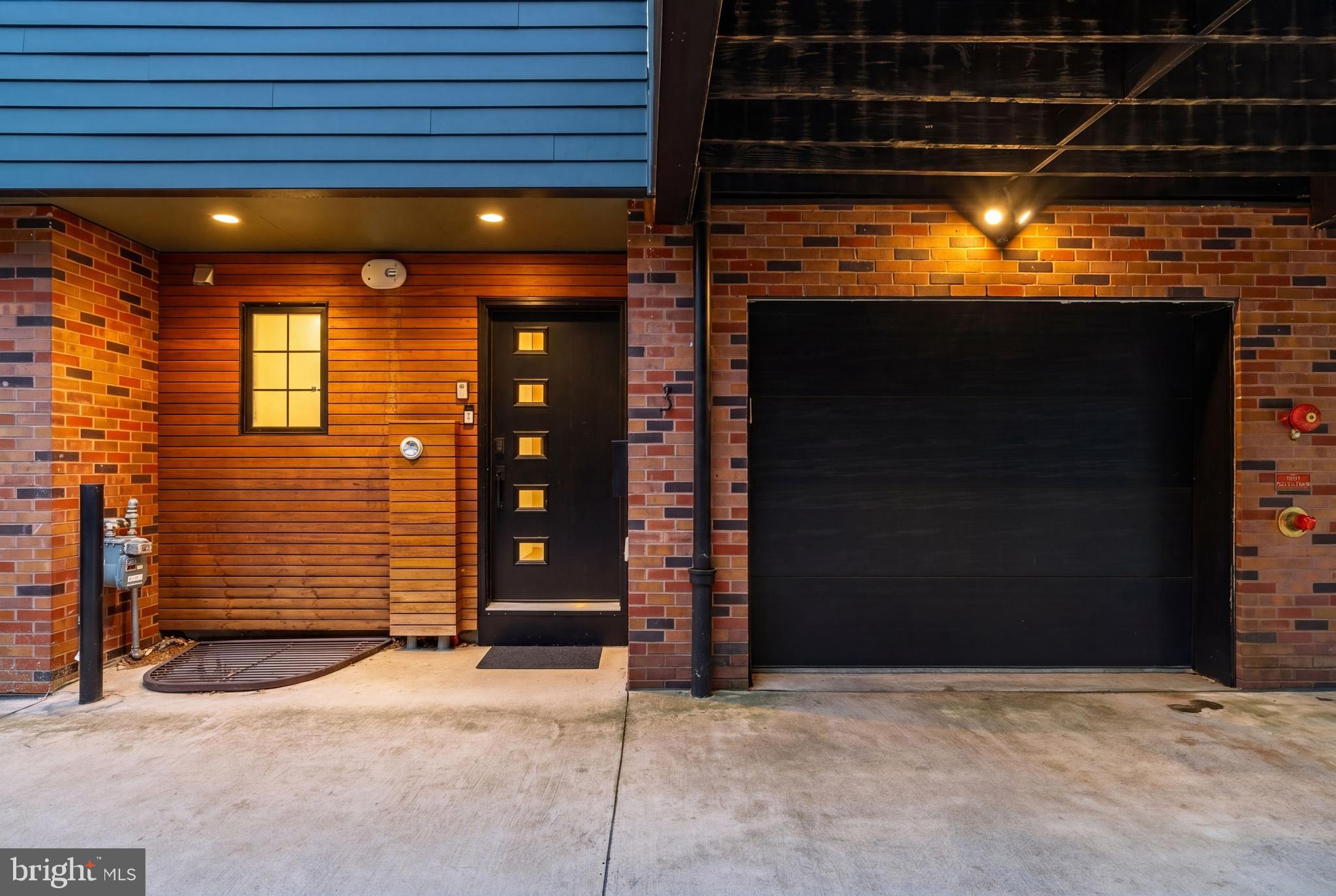 Price improvement Alert - an offering at exceptional value in the heart of Fishtown!! Presenting Unit #3 in the Shack 6 community— one of Fishtown’s most sought-after private communities credited for its blend of exceptional craftsmanship, modern luxury, and thoughtful design all in an  unbeatable location and within the Alexander Adaire school catchment. Tucked away but in close proximity to the energy of Frankford Avenue, the home enjoys a rare sense of privacy and tranquility with an off-street drive aisle and secure garage parking.

The main living level offers an open yet intimate layout designed for everyday living. A private terrace with trex composite decking seamlessly extends the living space outdoors through an accordion-style glass door by Jeldwen. The adjoining chef’s kitchen is a true centerpiece, featuring premium Bosch appliances, dual ovens, a 7-foot quartz island, and floor-to-ceiling custom lacquer cabinetry. Oversized north-facing windows throughout the home overlook beautifully landscaped gardens, filling every room with soft natural light.

The second and third bedrooms are positioned above the main living floor and include custom built-in closets, offering flexibility for family, guests or office space. Occupying the entire top floor, the primary suite serves as a private retreat complete with a spacious walk-in closet, spa-like ensuite bath, and access to an expansive roof deck showcasing sweeping skyline views.

Additional highlights include remaining (full) tax abatement benefits, secure parking, and a prime location just steps from Frankford Avenue’s acclaimed restaurants, boutiques, cafes, and nightlife. Residents enjoy immediate access to the best of Fishtown while still enjoying the quiet comfort of this exclusive private community.