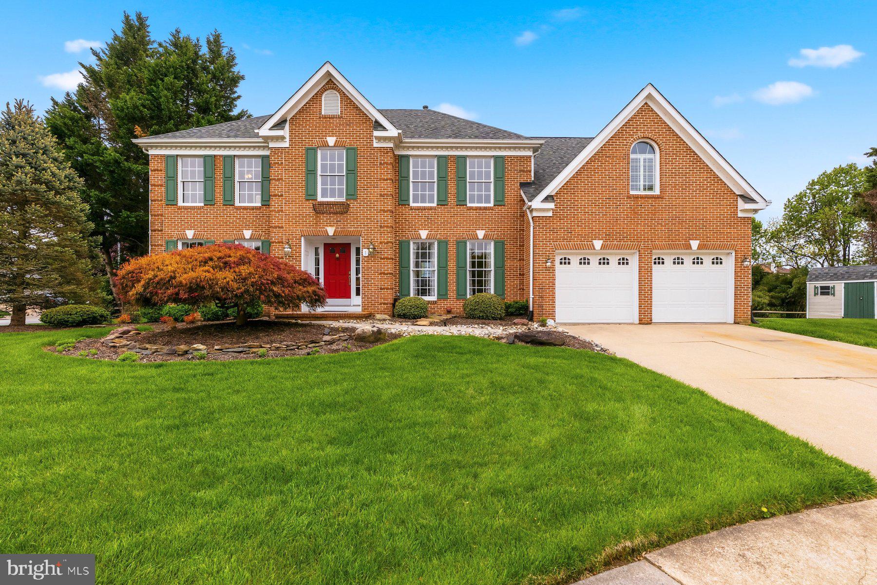Welcome to this exceptional brick front Colonial in the highly desirable Cub Hill area, offering 5 Bedrooms, 3 Full Baths, 1 Half Bath, over 4500 sq. ft of finished living space and a spacious 2-car garage. Beautifully landscaped grounds, timeless curb appeal, and a fenced rear yard create the perfect setting for this impressive home.

Step inside the center hall foyer featuring gleaming wood floors that continue through much of the main level. The spacious formal living room is filled with natural light and offers an inviting place to gather, while the dining room showcases crown molding, chair rail detailing, and wood flooring.

The heart of the home is the amazing updated gourmet kitchen, thoughtfully designed with custom wood cabinetry, granite countertops, a large center island with built-in oven and pendant lighting, gas range, double sink, wood floors, and a roomy breakfast area and butlers pantry. The kitchen flows seamlessly into the dramatic two-story vaulted family room featuring a stunning two-story brick wood-burning fireplace, skylights, wood floors, and sliding doors leading to the screened porch—perfect for indoor and outdoor entertaining. A main level den/office provides a quiet and flexible workspace.

Upstairs, the enormous primary suite offers a private retreat with a sitting area, two walk-in closets, and a spacious en suite bath complete with soaking tub, separate shower, and double vanities. Bedroom two is bright and roomy with its own sitting or study area, while bedrooms three and four are generously sized and finished with luxury vinyl plank flooring. A second full bath completes the upper level.

The finished lower level adds even more living space with a 5th bedroom or home office, a huge recreation room, dedicated gym room, plus utility and storage areas.

Outside, enjoy the beautifully landscaped yard, fenced backyard, screened porch, and storage shed for lawn equipment.