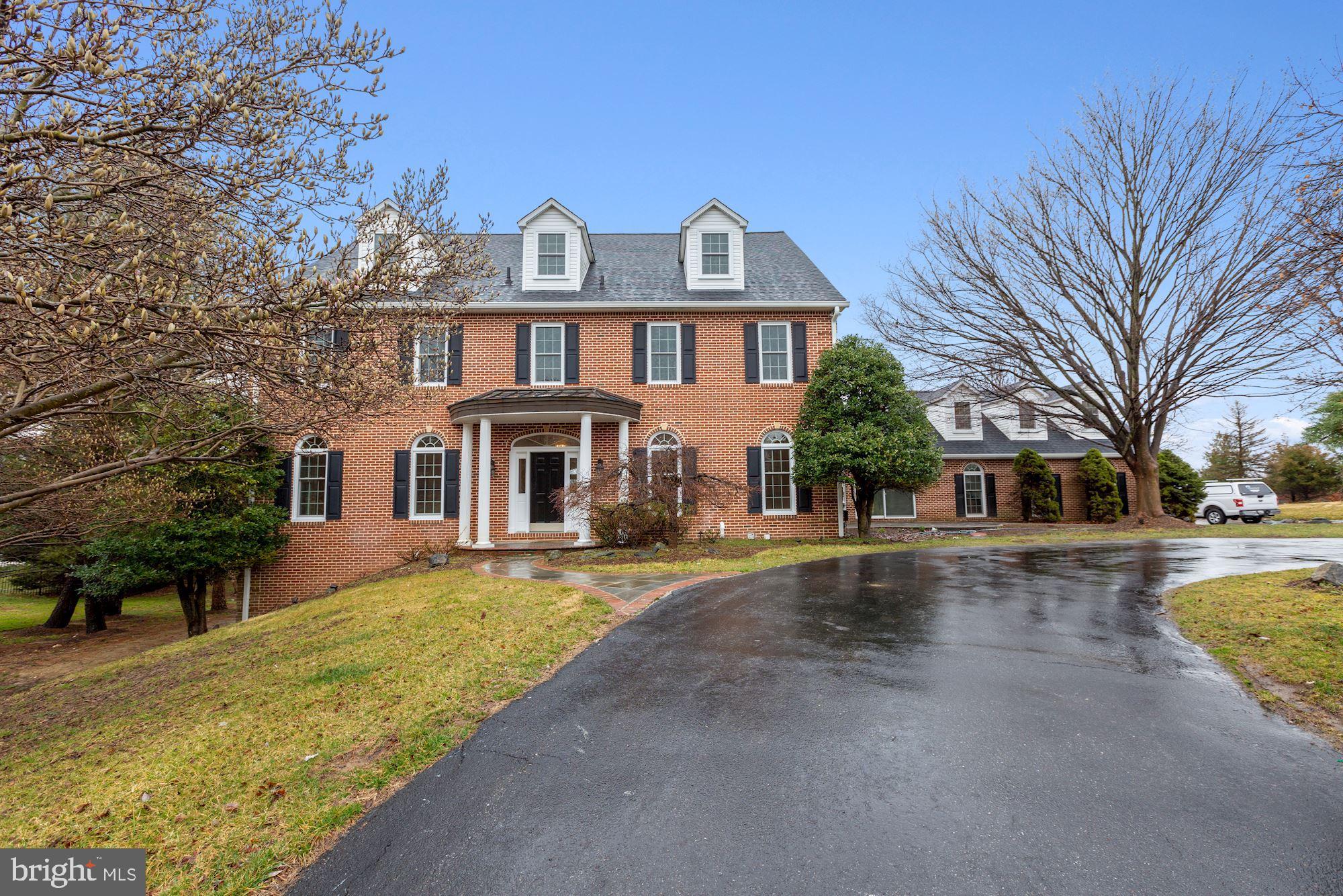Fantastic newly renovated,  8,000 SF, brick colonial adjacent to the 25 acre Greenbriar Park .   Complete top-to-bottom renovation on four finished floors including all new kitchen and bathrooms, freshly painted interior, all new hardwood floors, new windows, new roof and so much more!  It's like NEW.   Enjoy a very usable floor plan with spaces we all need these days--an open Kitchen/Family Room, Main Level Home Office, Sun Room and Private Home Office/Studio above the garage, plus a fully finished 3rd floor and fully finished, daylight walk out lower level.   Potential for multi-generational living: potential separate lower level 1 bedroom and 1 den apartment with 2 baths  with its own laundry room and Setup for a second kitchen.  Two flat acres rolling back to woods.  Room for a pool!  Wait till you see it!  You  are going to love it!   Note:  Furnished room photos are virtually staged.