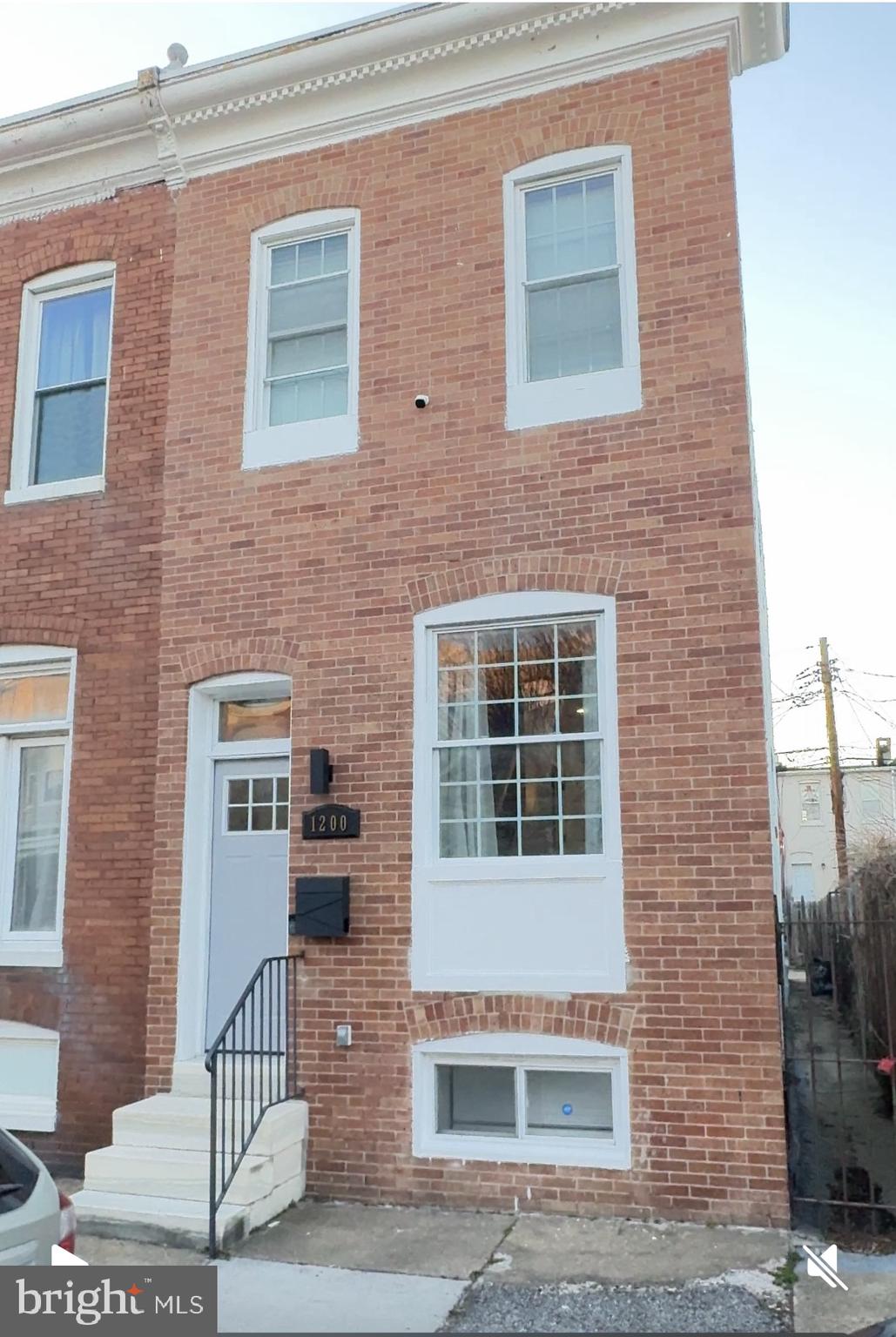 This is it...  Handsome end-unit Row Home in the Heart of Pig-Town Historic District..  this property is absolutely perfect in every way for the most discerning buyer..  From the Lovely brick front- faced exterior, that "Sparkles",   step into the split foyer of the home,   into the Bright and Sunny  Open Concept, w/ Gleaming hardwood floors, lovely Exposed brick towering-over, and many many shades of custom Grey paint throughout..  the beautifully groomed contemporary kitchen features exotic counter-tops, w/ Oodles of  counter space, stainless -steel appliances,  and lots of 46'inch cabinets for storage and a large pantry..   The Open floor-plan offers lots of space, w/ Living Room and kitchen table space, and also, an inviting formal dining room area flex/family room that Opens to floor-to-ceiling window w/views of the private well-groomed backyard space.  step down through a second split entry-way and out into the backyard, with concrete finished patio, perfect for entertaining or parking, , or step down into the fully-finished basement with a large Open concept/hardwood floors, an a Full-bath with upgraded custom bath and cabinetry..  walk-up into the handsome exposed brick Upper level entry-way, into the lovely MBR, and secondary bedroom, with lots of custom closet space, and a lovely upgraded  Full-Bath with Custom cabinetry,counter-tops and upgrades.  This end-unit Row home is very Handsome & Cozy, and nestled on a quiet street with tons of parking, and steps from restaurants/ shops, and within minutes from the Sports Arena's,  both Raven's and O's Stadium,  Casino's  and bustling scene of Downtown Charm City.. Hurry this one is Cute-as -a button and will not last..
