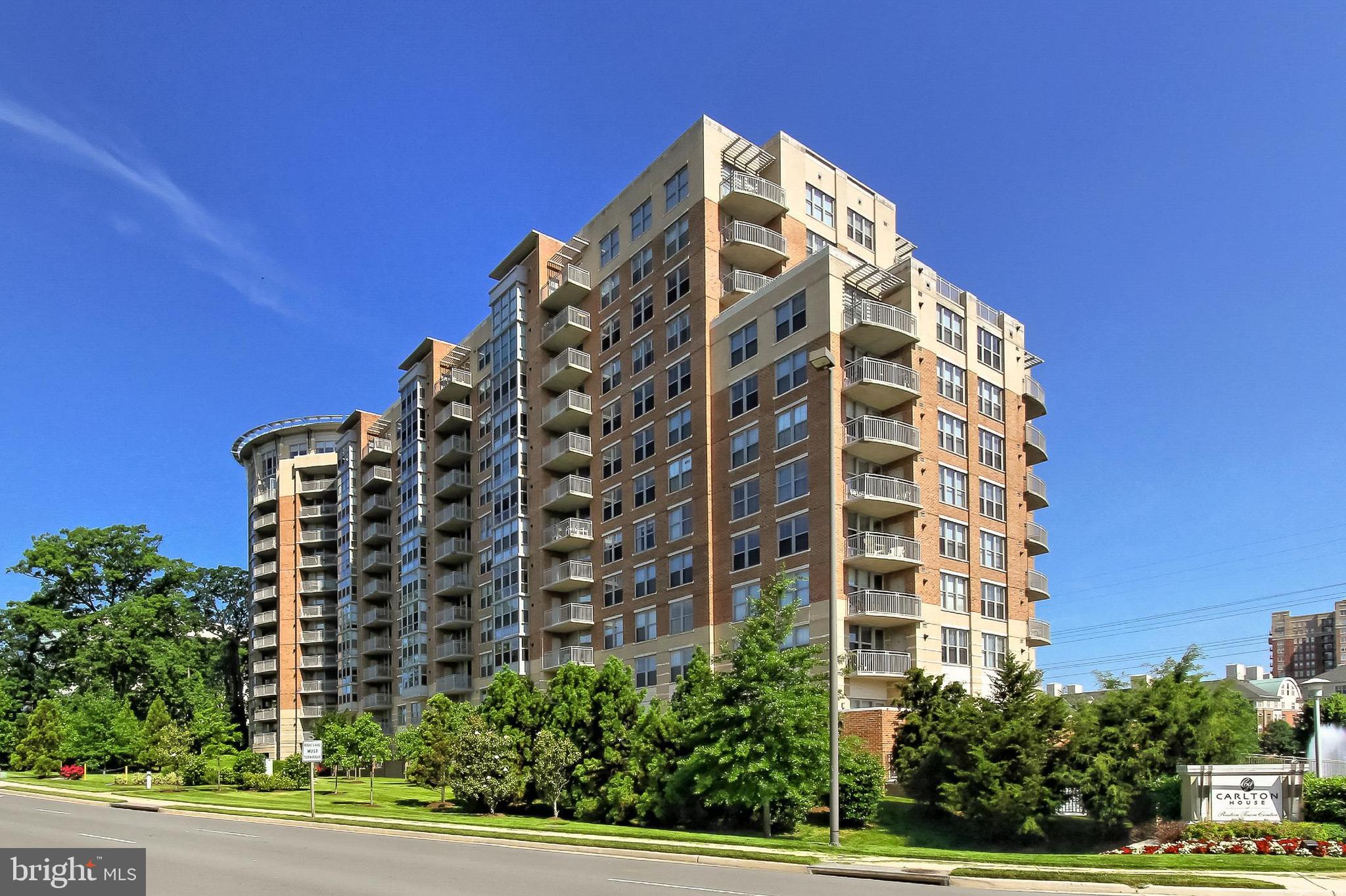 Welcome to Unit #1018 at 11800 Sunset Hills Road, a charming 1 bedroom, 1 bath condo in the prestigious Carlton House Condominium community in Reston, Virginia. This elegant home offers a host of desirable features, including a secure lobby with concierge service, a private balcony with stunning high-rise views, an open and airy floor plan filled with natural light, and a beautiful kitchen and bath. With in-unit laundry and exceptional amenities, this condo is move-in ready and ready to become your new home.
As you enter, hardwood floors greet you in the foyer, leading you into the living room. A wall of floor-to-ceiling windows and a glass door bathe the space in sunlight, while offering access to your private terrace, where you can enjoy breathtaking panoramic views. The open design effortlessly blends indoor and outdoor living, perfect for relaxing or entertaining. The dining area, illuminated by chic lighting, seamlessly flows into the sparkling kitchen, designed to inspire any chef with its gleaming granite countertops, ceramic tile flooring, and stainless steel appliances, including a ceramic top range and built-in microwave.
The primary bedroom offers a lighted ceiling fan, ample room for a sitting area, and a walk-in closet with built-in shelving. The bathroom features a furniture-style vanity with a granite countertop, sleek lighting, and spa-inspired tile flooring and tub/shower surround. A laundry closet with stackable machines and plenty of storage adds to the convenience and appeal of this home. This unit also comes with one assigned parking space in the attached covered and secure garage.
The Carlton House Condominium provides an array of luxurious amenities, including an upscale lobby, rooftop pool and patio, community center, party room, fitness center, theater, billiards area, convenience store, business center, and a serene courtyard with pond views. Reston Town Center is just around the corner, offering a vibrant array of shopping, dining, and entertainment options, while commuters will appreciate easy access to the Dulles Access Road, Fairfax County Parkway, Georgetown Pike, and Routes 7, 28, and 50. Outdoor enthusiasts will enjoy exploring the numerous parks in the area, from skateparks and ballparks to peaceful wooded trails. With its ideal location and fantastic amenities, this condo is the perfect place to call home. Welcome home!
***Recent improvements include a 2024 LG refrigerator and a 2022 hot water heater.***