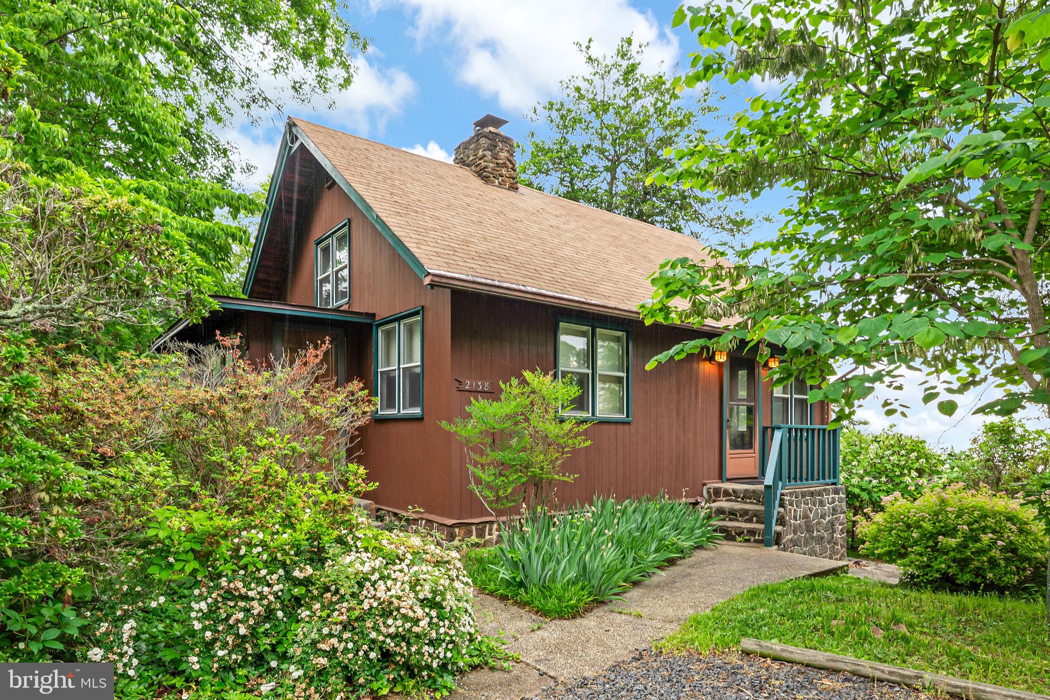 This authentic rustic cabin in the highly sought-after Scientist Cliffs community offers a rare blend of historic soul and is a quiet, serene sanctuary perched above the Chesapeake Bay! From the moment you step onto the rich hardwood floors, the frantic pace of the outside world fades away, replaced by the crackle of the stone wood-burning fireplace and the shimmer of the water. The main level has plenty of natural light, which captures the shimmering beauty of the Bay! The open-concept living space is anchored by masterful stonework, creating an inviting atmosphere for reflective mornings or cozy evenings. The partially finished basement provides a versatile flex space—perfect for a quiet home office, art studio, extra storage—ensuring the home evolves with your needs. Step outside to immerse yourself in the preserved beauty of the American Chestnut Land Trust (ACLT). With 26 miles of hiking trails and direct bay access for morning kayak sessions, nature is your primary amenity. Scientists’ Cliffs is celebrated for its natural beauty and rich heritage, offering a lifestyle defined by the rhythms of the bay and the surrounding forest. Spend your days by the swimming pool, on the pickleball and tennis courts, or at the community beach featuring a private boat ramp. The historic Community House and Chestnut Cabin serve as the pulse of the neighborhood, hosting a vibrant calendar of social events and summer programming!