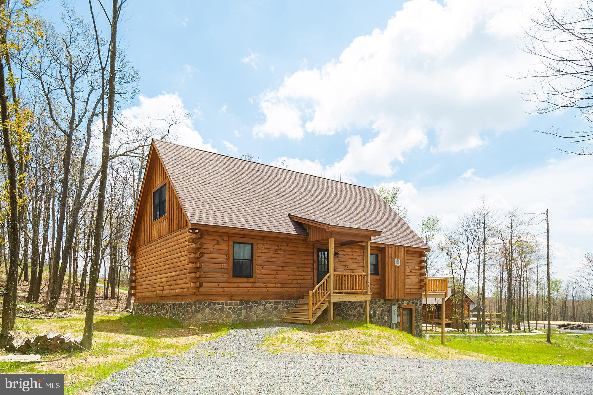 UPDATED PICTURES COMING SOON! Currently operating as the vacation rental "John's Place," this mountain-view 4BR, 3 full/1 half bath retreat sleeps 10 and is ready for continued rental use or personal enjoyment. Built in 2022, the single-family home offers approx. 1,708 sq ft on a 0.58-acre homesite in McHenry's Lodestone/Biltmore area, near Deep Creek Lake, Wisp Resort, Funland, skiing, hiking, dining, and year-round attractions. The unfinished basement provides excellent opportunity for future expansion, with room to create a game room, bonus living area, or potential additional bedroom space, subject to applicable requirements. The adjoining 0.64-acre Lot 34 is also available for purchase from the same seller, offering valuable elbow room, privacy, and future possibilities for the right buyer. Buyer to verify rental permits/regulations, occupancy, HOA requirements, utilities, and acreage.