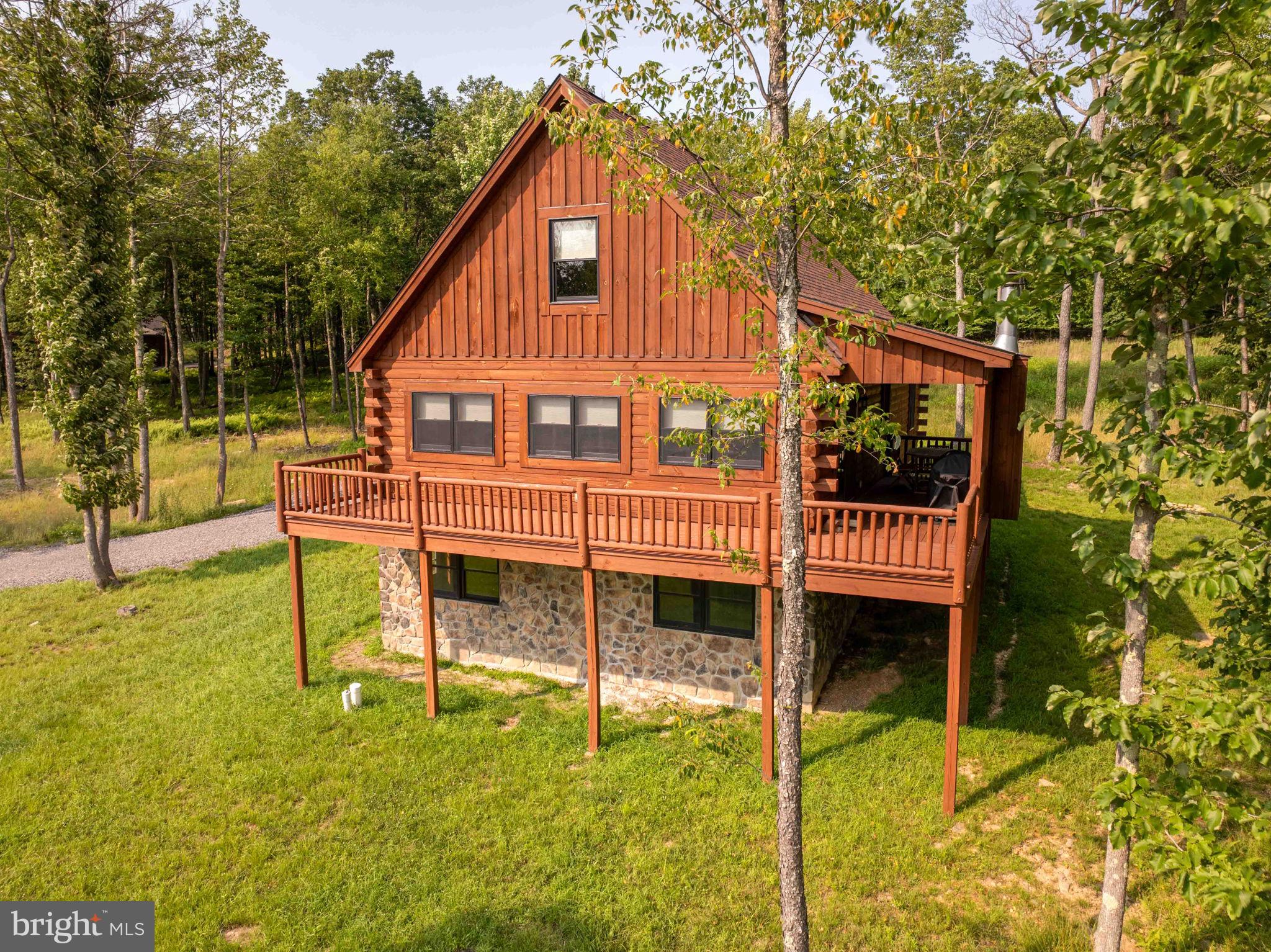 UPDATED PICTURES COMING SOON! Currently operating as the vacation rental "John's Place," this mountain-view 4BR, 3 full/1 half bath retreat sleeps 10 and is ready for continued rental use or personal enjoyment. Built in 2022, the single-family home offers approx. 1,708 sq ft on a 0.58-acre homesite in McHenry's Lodestone/Biltmore area, near Deep Creek Lake, Wisp Resort, Funland, skiing, hiking, dining, and year-round attractions. The unfinished basement provides excellent opportunity for future expansion, with room to create a game room, bonus living area, or potential additional bedroom space, subject to applicable requirements. The adjoining 0.64-acre Lot 34 is also available for purchase from the same seller, offering valuable elbow room, privacy, and future possibilities for the right buyer. Buyer to verify rental permits/regulations, occupancy, HOA requirements, utilities, and acreage.