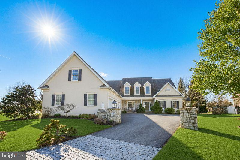 Welcome to an exceptional offering in Bent Creek Country Club, Lancaster County’s only gated community. Ideally situated along the 7th fairway, this residence offers expansive golf course views and a private cul-de-sac setting on approximately 0.4 professionally landscaped acres within the Manheim Township School District.

The stately exterior, mature landscaping, and three-car garage create a striking first impression. Inside, the open-concept floor plan is filled with natural light and designed for both everyday living and entertaining.  A screened porch and expansive patio overlook the fairway, providing ideal outdoor living and gathering spaces.

The first-floor primary suite offers convenience and privacy.  Each additional bedroom includes a private en suite bath, for a total of four bedrooms and five-and-a-half baths.

The finished lower level adds significant living space, complete with a full bath, generous storage, and flexible areas suitable for a home gym, media room, office, or guest space.

Meticulously maintained, this property presents a rare opportunity to own a golf course residence in one of the area’s premier communities.  Floor plans are available at the end of the photo gallery.