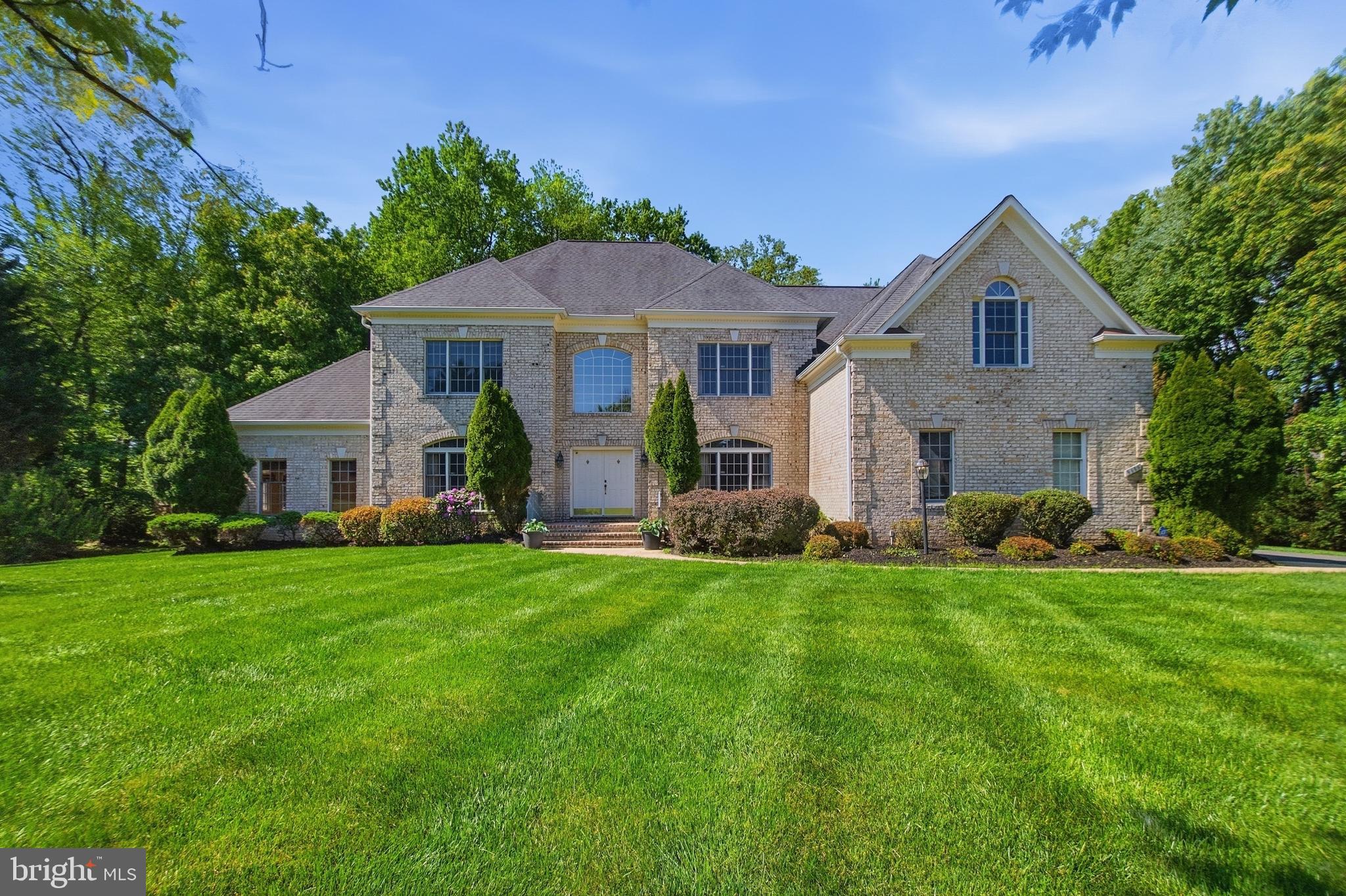 Unbeatable convenience on a charming cul-de-sac, with proximity most of Great Falls can't offer. Minutes to Tysons, the Metro, the Toll Road, Dulles Airport, and DC. In the Langley High pyramid via Colvin Run Elementary and Cooper Middle.
Over 7,000 square feet across three finished levels. A welcoming hardwood foyer on the main level opens to a grand family room anchored by a brick raised-hearth fireplace. The stepped living room flows into a bright sunroom. A country kitchen, library, and formal dining room round out the main floor. Step outside to a generous composite deck overlooking a private, tree-lined backyard. Upstairs, the expansive primary suite offers a true retreat, complete with a massive en-suite bath and walk-in closet. The walk-out lower level is roughly 2,000 finished square feet. Freshly repaved driveway, new garage doors, meticulously maintained throughout. The listing agent is related to the sellers.