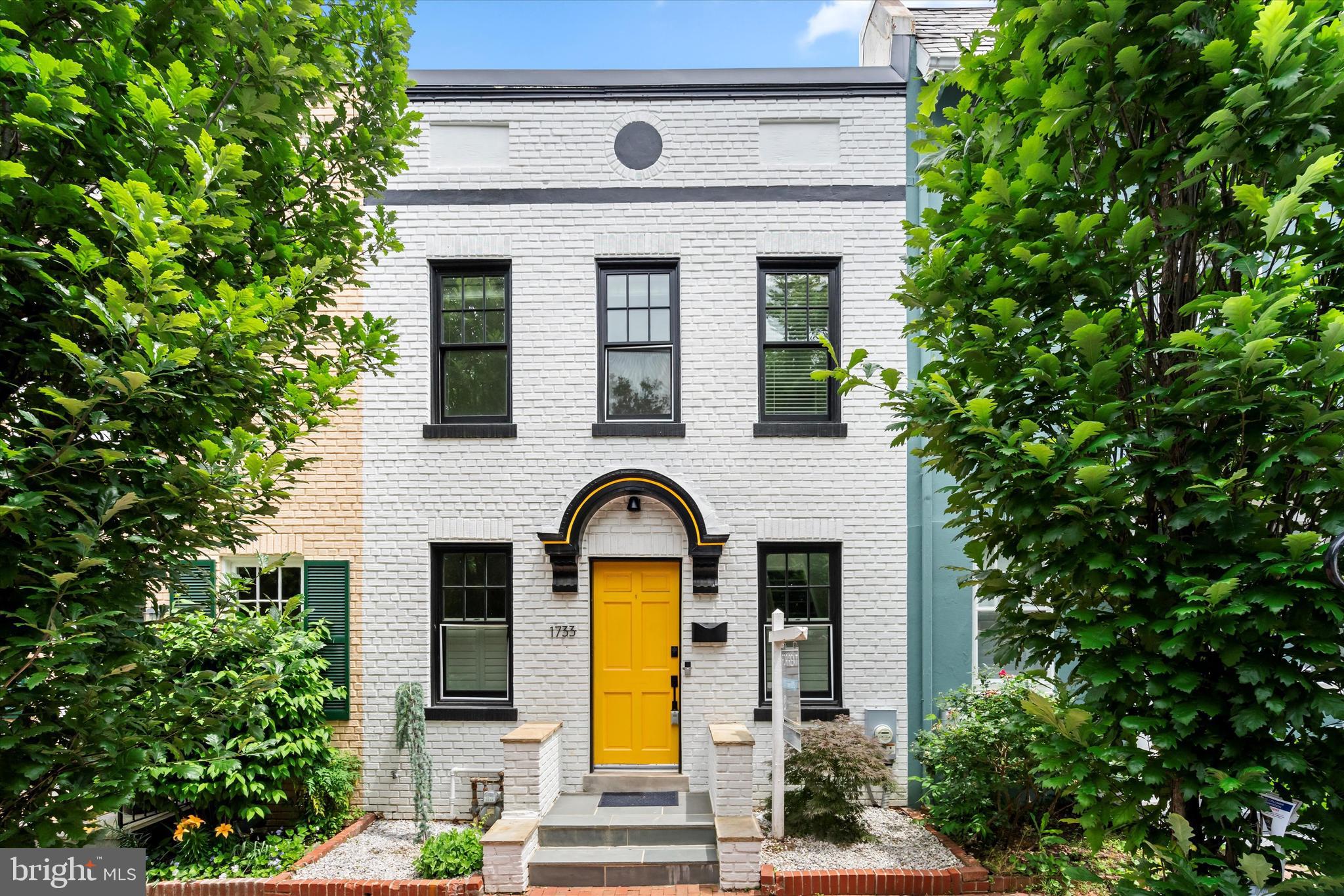 Classic Georgetown row home with modern finishes and updates throughout.  Main level offers an open concept with a recently remodeled kitchen featuring stainless steel appliances and quartz countertops.  Light hardwood flooring and ample windows create a light airy feel.  Custom built-ins offer a level of functional storage and beautiful design aesthetic.  French doors offer access to your private courtyard perfect for entertaining or relaxing.  Upstairs there are 2 generously sized bedrooms with large closets and an updated luxury bath.  Multiple skylights provide natural light to both the hall and bathroom.  The basement offers a tremendous amount of flexibility and can be used as a third bedroom, guest space, family room or whatever you need.  HUGE walk-in closet and another full bath.  The basement has a walkout to the backyard.  34th St NW is a one-way street and offers ample street parking right in front of the home.