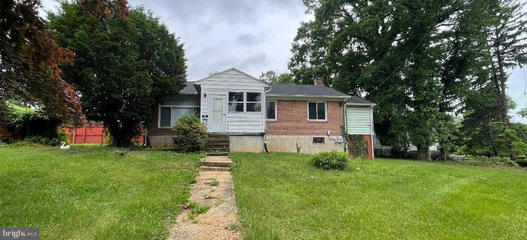 Buyers come and take a look at this spacious 3 bedroom, 3 full bath rancher on a tree lined street in Grove Park. This home features a open living/dining room combo with hardwood floors, a spacious kitchen with some stainless steel appliances. Primary bath has a double sink vanity and step-in jetted tub. The lower level has a possible 4th bedroom or home office and a full bath on the lower level. Large rec room with built-in dry bar. Lower level laundry room and storage area. Home is situated on a huge corner lot that is almost a quarter acre, with a partial fence around the rear. Plenty of possibilities with this home.  Central location near schools, shopping and major roads. Easy access to 695, Wabash Avenue, and Northern Parkway. Check out this home today!