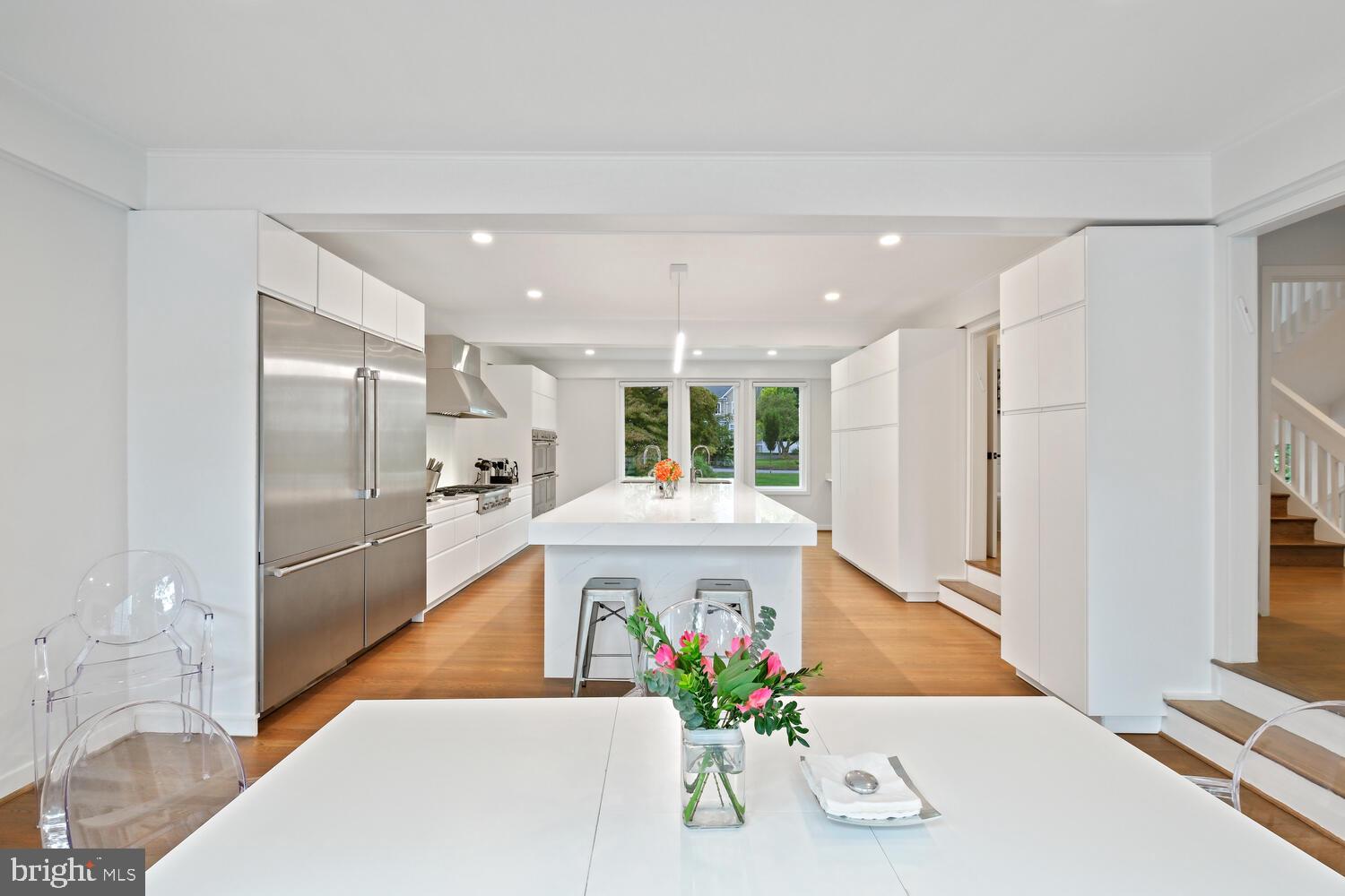Welcome to 6107 Neilwood Drive, where luxury meets cutting-edge technology in the serene LuxManor neighborhood. Nestled on a peaceful cul-de-sac, this home offers a harmonious blend of elegance and modern convenience.

Upon entering, you're greeted by the heart of the home: an expansive, sun-drenched kitchen designed for both style and practicality. At its center stands a grand 16-foot island, ideal for meal preparation or casual gatherings. The kitchen is a chef's dream, equipped with four ovens—including two steam ovens—a five-burner gas cooktop, an electric induction cooktop, dual sinks, dual dishwashers, and instant hot water faucets. Twin large refrigerators provide ample storage, while premium Thermador appliances elevate the space with sophistication.

Entertainment reaches new heights in this home, with a full-house Sonos sound system, a dedicated home theater featuring a sophisticated media control deck, and a basement outfitted with a giant screen and projector connected to high-speed FIOS. Additional wall-mounted TVs are thoughtfully placed in the guest room, office, and gym, which also features a spacious aerobic dance and workout area complete with wall-to-wall mirrors and bars.

The home has been meticulously maintained with Ecoshield pest control and TruGreen lawn care. Outdoors, an oversized deck extends from the kitchen and living room, providing a serene space for relaxation and entertaining. The property also includes a comprehensive security system with five Ring cameras, an ADT alarm system, and a state-of-the-art water filtration system. Convenience and elegance are evident throughout, with electric programmable blinds on the first two levels and stylish manual blinds on the upper floor.

Ideally located near Tilden Woods Park, Tilden Woods Pool, and North Farm Pool, this residence offers easy access to major routes, the North Bethesda Metro Station, and local attractions like Pike & Rose, Montgomery Mall, and the Strathmore Music Center.

This exceptional home is more than just a residence—it's a lifestyle.