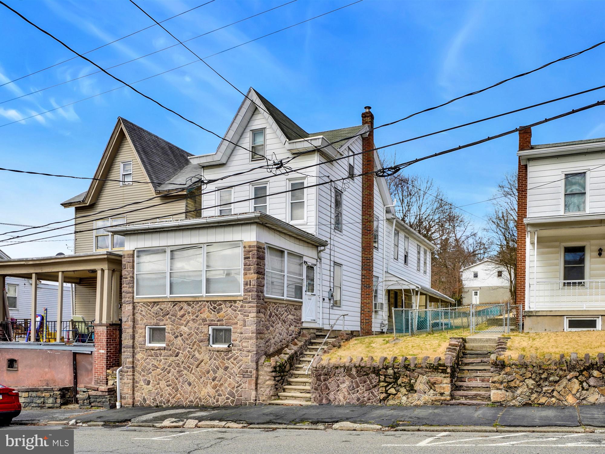Welcome home to this well sized 3BR/1BA single home in Schuylkill Haven Borough. Situated on the outskirts of the borough, but walking distance to the downtown, the home sits on a partially fenced lot with a large yard and a rear detached oversized two car garage with lower level storage.  The first floor has an open layout with its welcoming entry sunroom, combination family and living rooms, dining room, and vintage style kitchen. Up the open wood staircase, there are three large bedrooms, each with a closet, and access to a walk-up attic to accommodate all your extra storage needs. Other features include a covered side porch for outdoor enjoyment in any weather, original woodwork throughout, some replacement windows, and hardwood under carpets. Priced to sell, schedule your showing today.