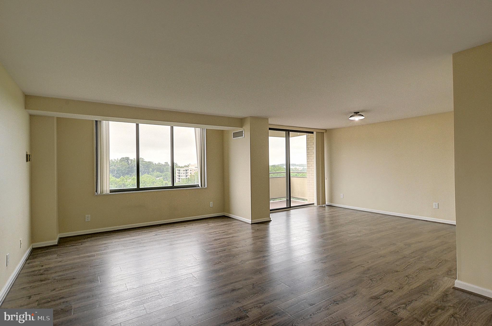 Welcome to this bright, open one-bedroom home at The Promenade. An open layout and large windows fill the space with natural light, and a spacious private balcony looks out over lush green treetops for a calm, leafy setting high above it all.<br><br>

The popcorn ceiling was removed and replaced with a flat ceiling, and the asbestos was abated. Luxury vinyl plank (LVP) flooring runs throughout the home for an easy, cohesive feel. The kitchen offers speckled stone-look countertops, white cabinetry, a gas range, dishwasher, and a dedicated pantry closet for extra storage. An in-unit washer and dryer adds everyday convenience you won't find in every unit. <br><br>

The generous bedroom comfortably fits a king-size set and includes its own walk-in closet, with large windows that carry the same green views. The renovated bathroom feels like a retreat, with a glass-enclosed walk-in shower in marble-look tile, a mosaic accent band, and a sleek modern floating vanity.<br><br>

The Promenade offers resort-style amenities including indoor and outdoor pools, 7 tennis courts, pickleball, a racquet club house, and a state-of-the-art exercise and fitness center complete with an indoor pool, sauna, lockers, and hot tub. The building also provides outstanding conveniences with a 24-hour security gate house, front desk service, and a remodeled arcade with a variety of stores. Additional on-site services include a convenience store, dry cleaners, package room, beauty salon, party and game room, and travel agency.<br><br>

Tucked into the Pooks Hill area just off Rockville Pike, the location offers quick access to I-270 and I-495 and is close to shopping, dining, NIH, and Walter Reed, with downtown Bethesda just a short drive away. <br><br>