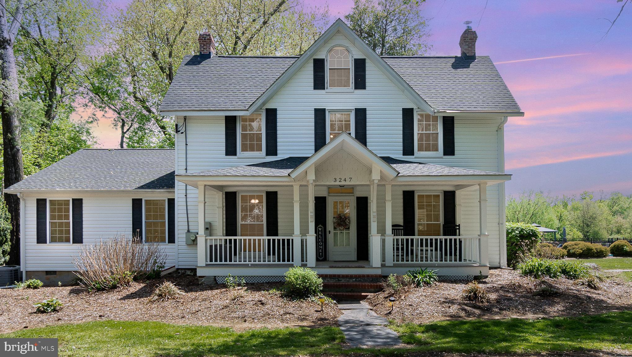 Step into timeless charm and modern convenience with this beautifully updated 5BR/2.5BA farmhouse , nestled on a serene 2.5-acre lot + an additional 2-acre parcel offering unmatched privacy and space-(approx. total 4.5 ac lot conveys with this listing).   Ideal for horse lovers, this property is fully enclosed and features two barns (sold as-is) with a stable, perfect for equestrian use or hobby farming.  The home blends historic character with modern upgrades, including a newly added kitchen, mudroom, and main-level primary suite complete with a cozy gas fireplace and a luxurious ensuite bath. Recent updates include a new roof, vinyl siding, generator, flooring, fencing, and a water softener system to name a few items—ensuring peace of mind and move-in readiness.    A bright and airy family room with a wall of windows + remote window shades showcases stunning views of the tranquil in-ground pool (new liner) and lushly landscaped grounds.  Upstairs, you’ll find 4 additional bedrooms and a charming screened-in porch with low-maintenance Trex-style decking—an ideal spot to relax and unwind with serene views of nature.  Outdoor living shines with a spacious Trex-style deck w/ retractable awning is dreamy for summer evenings under the mature trees,  while the massive 36'x30' three-car garage with 9-foot ceilings and an upper-level loft (with electric and water) offers versatile space for storage, a workshop, or future expansion. An adorable Amish-built shed near the pool, complete with electricity, adds even more flexibility as a pool house, studio, or "she-shed".  This historic yet thoroughly modern home is a rare, beautifully maintained gem—ready to welcome you HOME.  See attached tour video & list of the incredible improvements this home has to offer!
